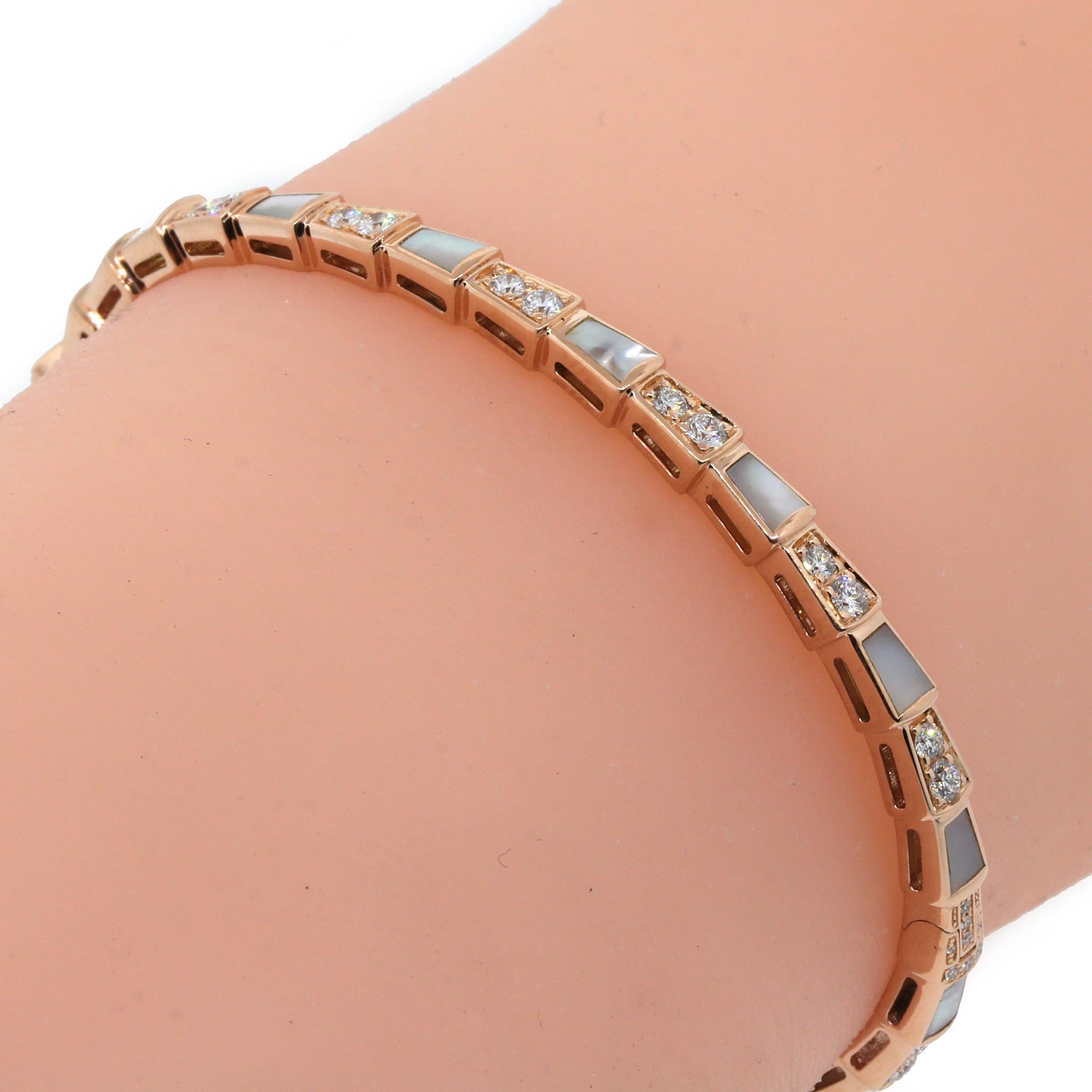 This Serpenti Viper bracelet is beautiful with Mother of Pearl inserts and pavé diamonds set in 18k Rose Gold. 

18 kt Rose Gold
Size: S = 15 cm
Diamond: 0.85 ct twd
Total Weight: 14.9 grams