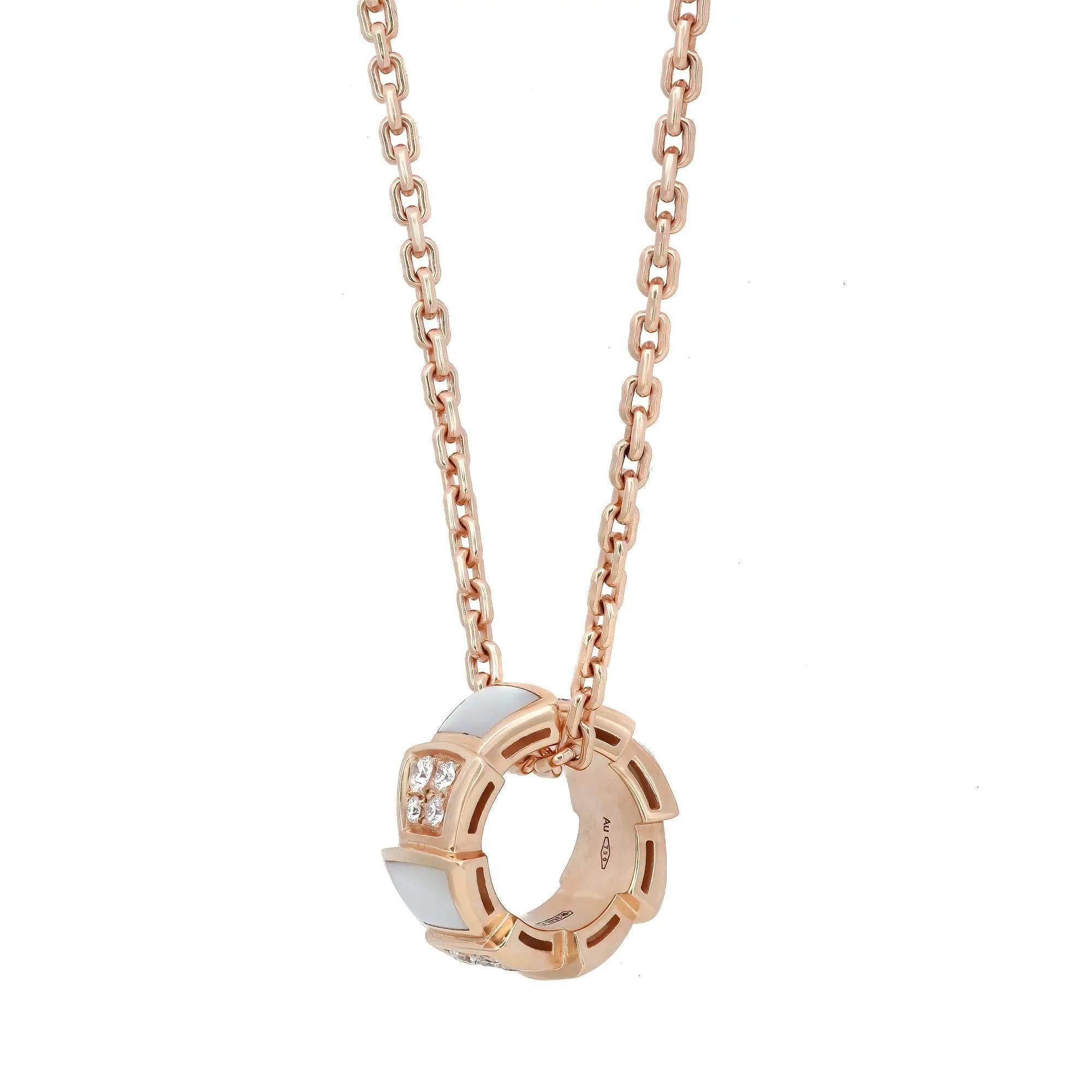Sophisticated and stylish, Bvlgari Serpenti Viper pendant necklace. This beautiful pendant coils sensually around the chain necklace and stands out the beauty of its enveloping curves studded alternatively with inserts of white mother of pearl on