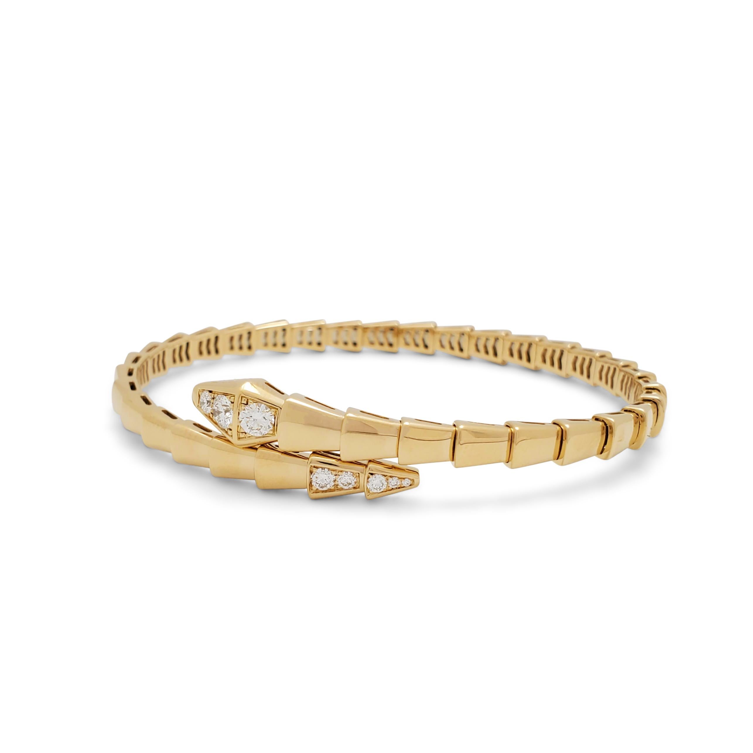 Authentic Bvlgari Serpenti Viper bracelet crafted in 18 karat yellow gold.  The head and tail of the snake design are set with round diamonds of an estimated 0.47 carats total weight.  Size M (17 cm).  Signed Bvlgari, Au750, Made in Italy, with