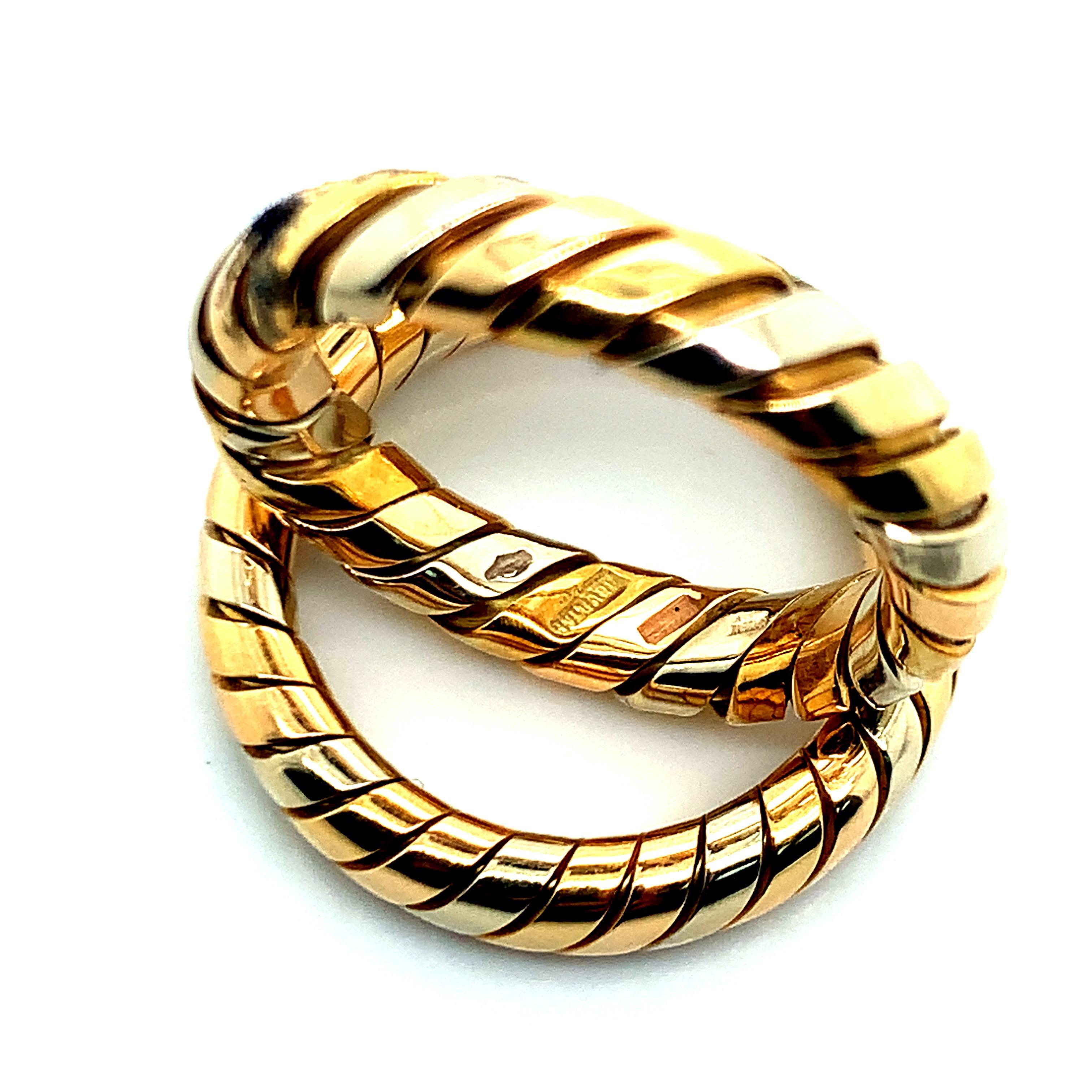 From the Tubogas collection, this set of two Bvlgari rings is made out of three 18 karat gold: yellow, white, and rose. Together, they weigh 12.3 grams. Size 6.