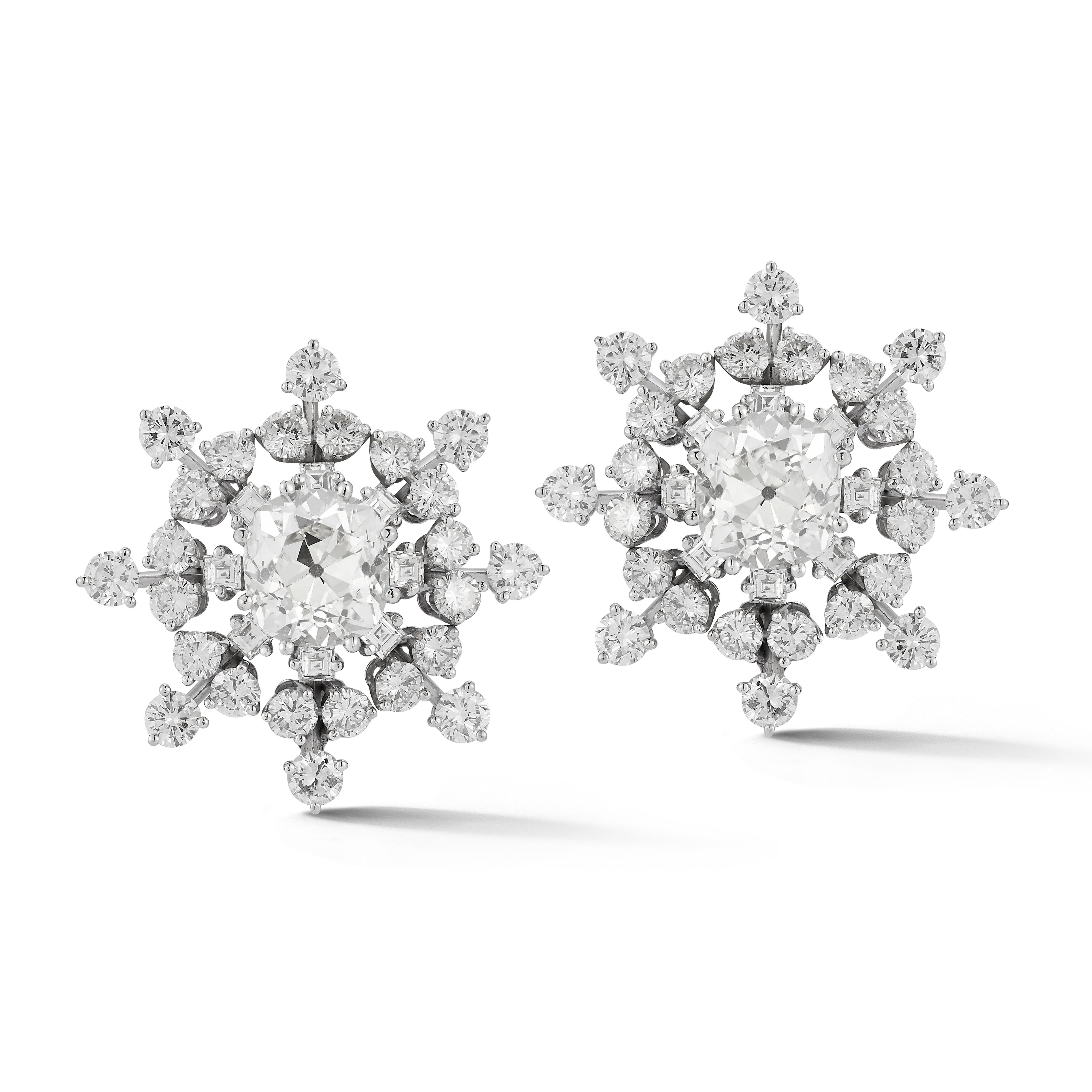 Bulgari Snowflake Diamond Earrings 

A pair of 18 karat white gold snowflake motif earrings each set with a central old European cushion cut diamond framed by 8 square cut diamonds and 24 round cut diamonds

Accompanied by the original box and 2