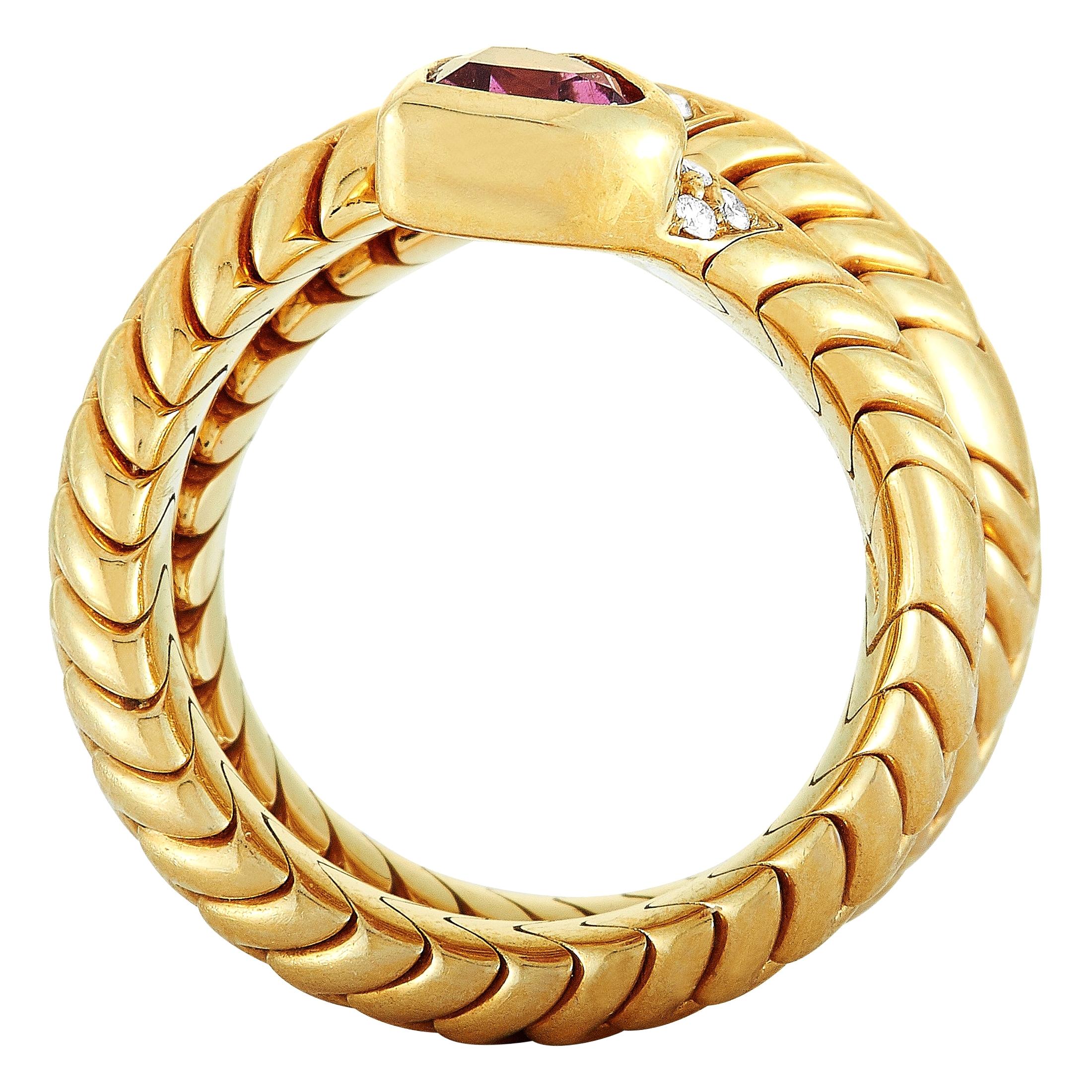 The Bvlgari “Spiga” ring is made of 18K yellow gold and set with diamonds and a pink tourmaline. The ring weighs 22.4 grams, boasting band thickness of 10 mm and top height of 4 mm, while top dimensions measure 8 by 17 mm.
 
 This item is offered in