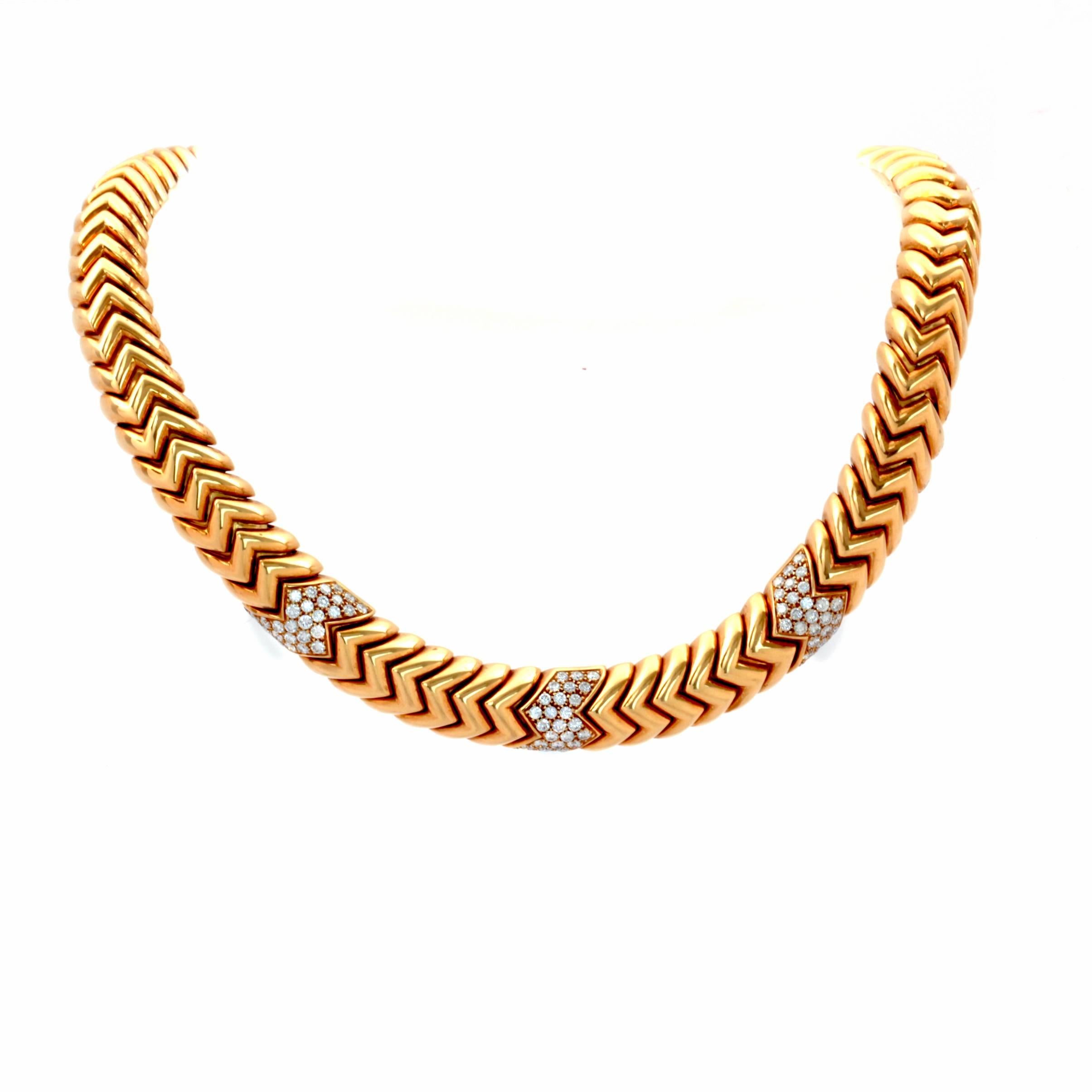 This diamond necklace by Bvlgari crafted in solid 18K yellow gold, from the Spiga Collection. 

The necklace showcases an exquisite series of gold zig-zag chevron links, embellished with 81 genuine Round cut Dazzling Diamonds approx: 4.05cttw, F-G