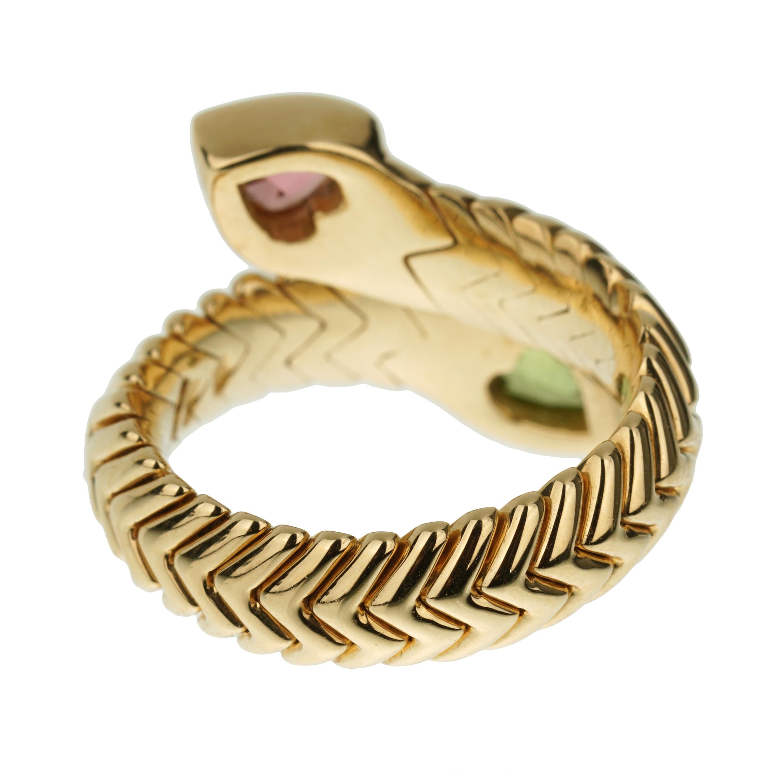 This exquisite vintage Bvlgari Spiga ring is a masterful blend of luxurious materials and iconic design, making it a standout piece in any jewelry collection. Crafted from rich 18k yellow gold, the ring showcases Bvlgari's signature Spiga pattern,