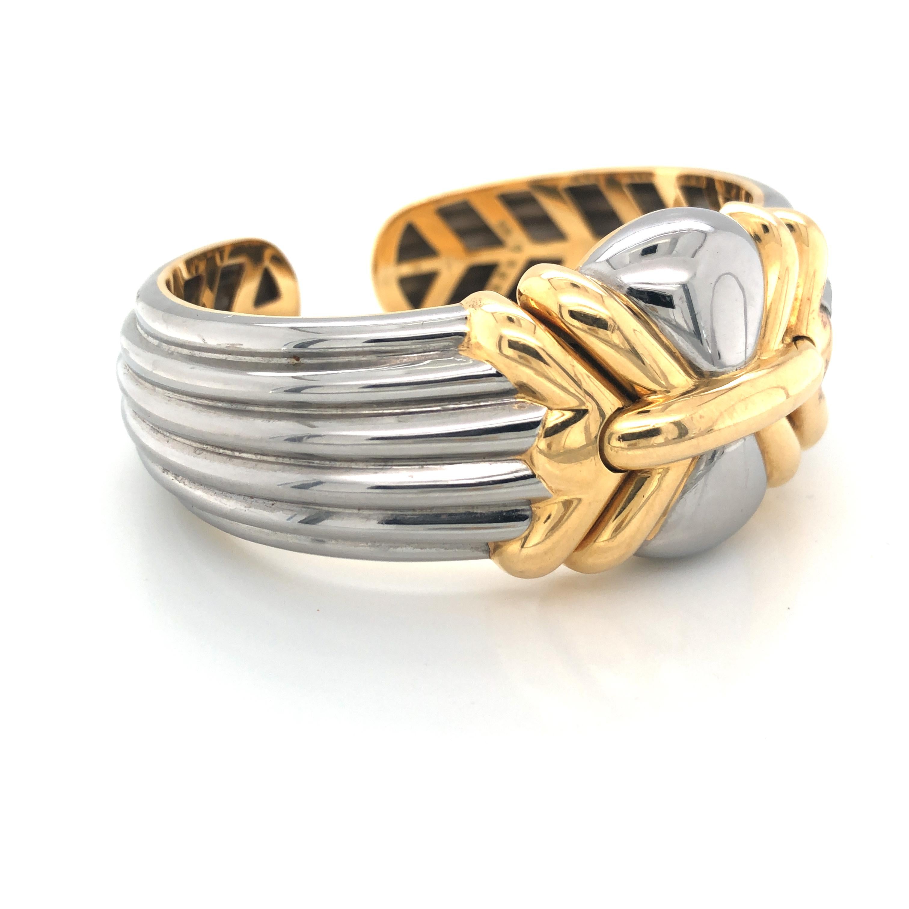Stainless steel and gold cuff bracelet by Bulgari . The just over 1