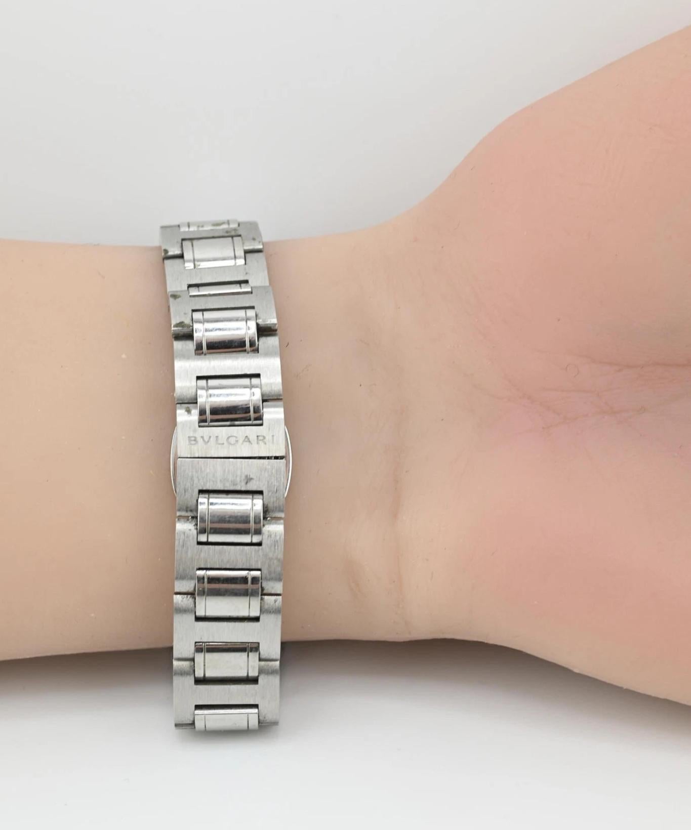 This elegant Bvlgari ladies watch is a refined statement of modern luxury and sophistication. Crafted from stainless steel, the timepiece features the iconic BVLGARI logo engraved around the bezel, emphasizing its timeless branding. The black