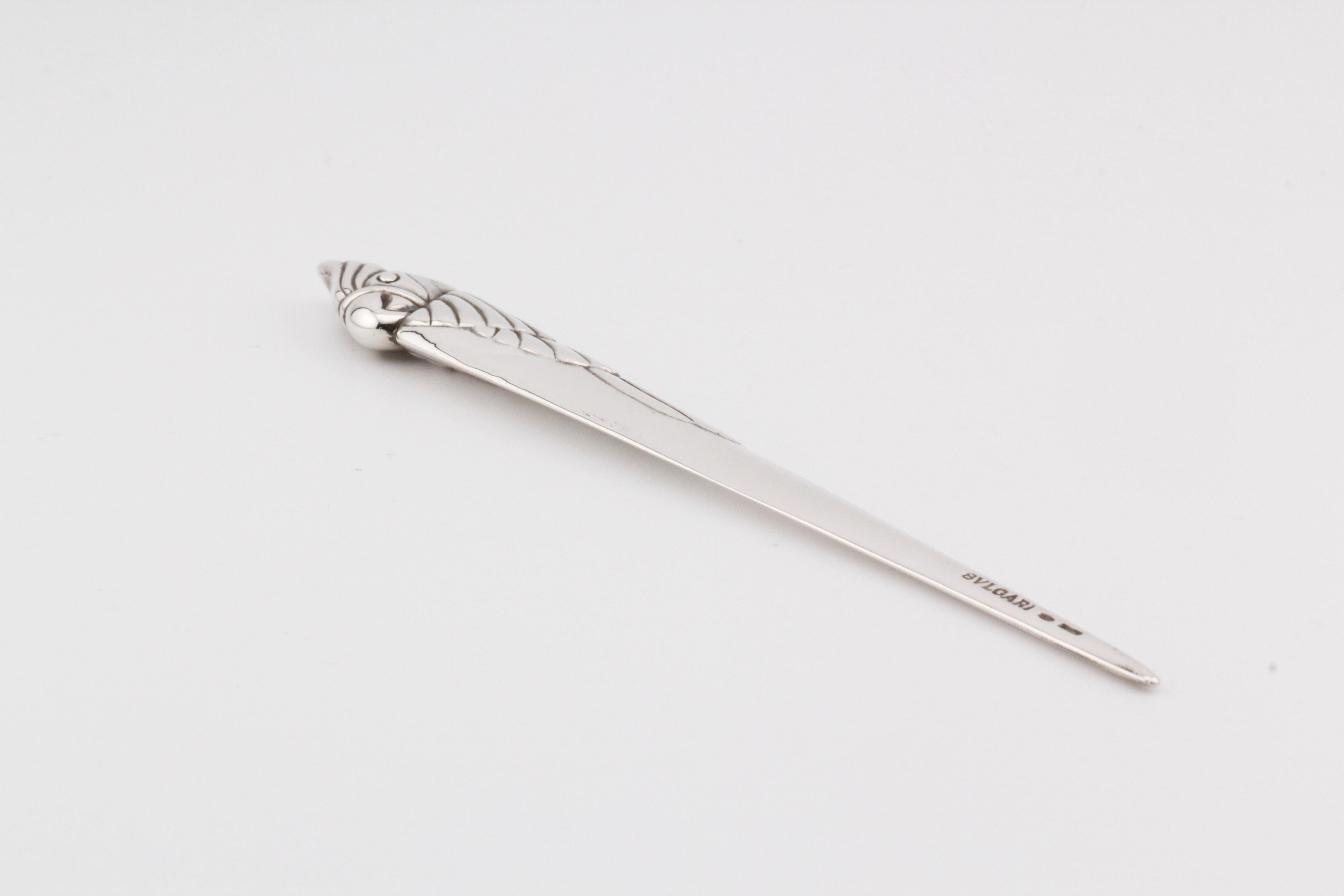 The Bvlgari Sterling Silver Vintage Cockatoo Bird Letter Opener is a luxurious and unique piece crafted by the renowned Italian luxury brand Bvlgari. This exquisite letter opener features a handle in the shape of a parrot bird, intricately detailed