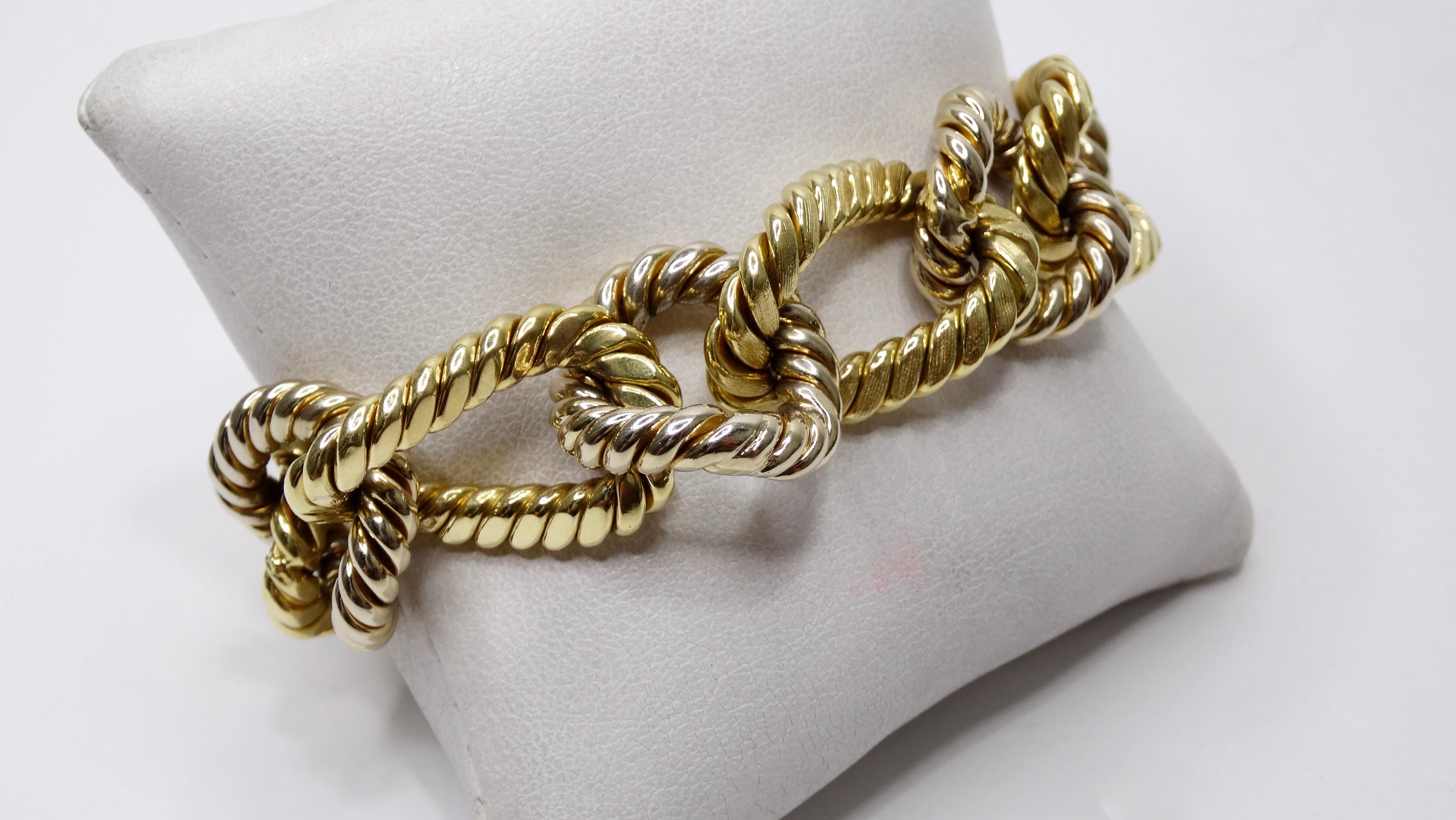  Circa late 20th century from Italy, this vintage bracelet features two tone 18k Gold chain links embossed with a rope pattern and finished with a tab closure and security latch. Edgy and classic, this Bvglari style bracelet will look great with all
