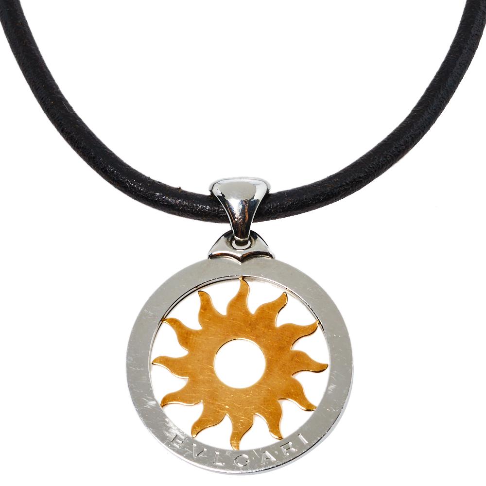 For the woman who loves fine jewelry, Bvlgari brings her this stunning Tondo Sun necklace that has a circular steel pendant with an 18k Gold sun motif within it. The pendant is strung by a black cord and fastened by a lobster clasp. This is one