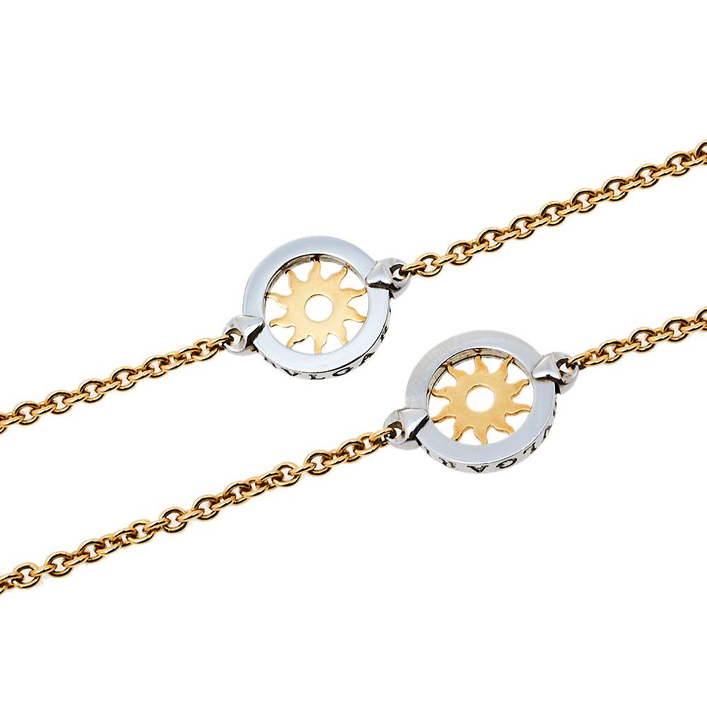 Part of the Tondo Sun collection, this Bvlgari necklace combines silver and golden colors. Its 18k yellow gold chain is coupled with stainless steel circle charms surrounding gold sun motifs. This necklace is complete with a spring ring