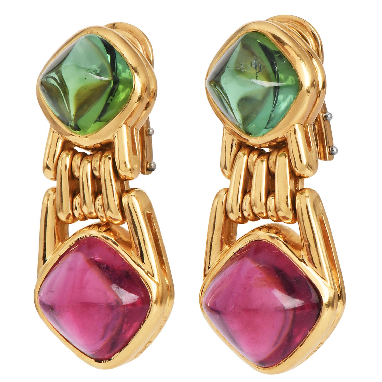 Bvlgari Tourmaline and Peridot Sugarloaf Drop Earrings

These striking Bvlgari drop earrings feature vibrant sugarloaf cabochons in pink and green tourmaline. Each gemstone is bezel-set, showcasing its vivid color and smooth, lustrous finish. The