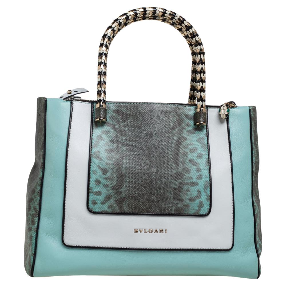 Bvlgari's Serpenti collection has stunning creations and this tote is a fine example. Crafted from tricolored leather & Kurung snakeskin, the Serpenti Scaglie tote is styled with retractable snake handles. The bag comes with a spacious fabric-lined
