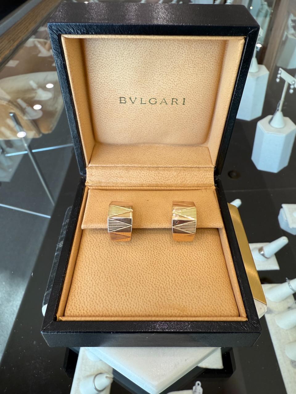 Bvlgari Yellow, White 
Rose Huggie Earrings
The Beautiful Earrings Have a Tricolor Gold Top
The Earrings Tapper From The Middle to The Ends
11.3mm - 9.3mm
They are 19mm Long 
Omega Clip Backs with a Post 
20.3 Grams 18kt Gold
Comes with a