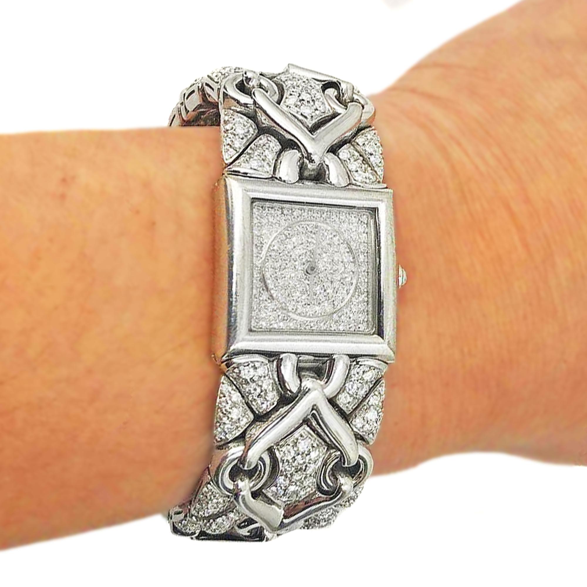 BVLGARI Trika 21mm 18K White Gold and All Diamond Watch

This incredible Bulgari ladies wrist watch is crafted with 18k white gold The watch band is designed with a unique, intricate pattern along with pavé set round-cut diamonds. The dial is a