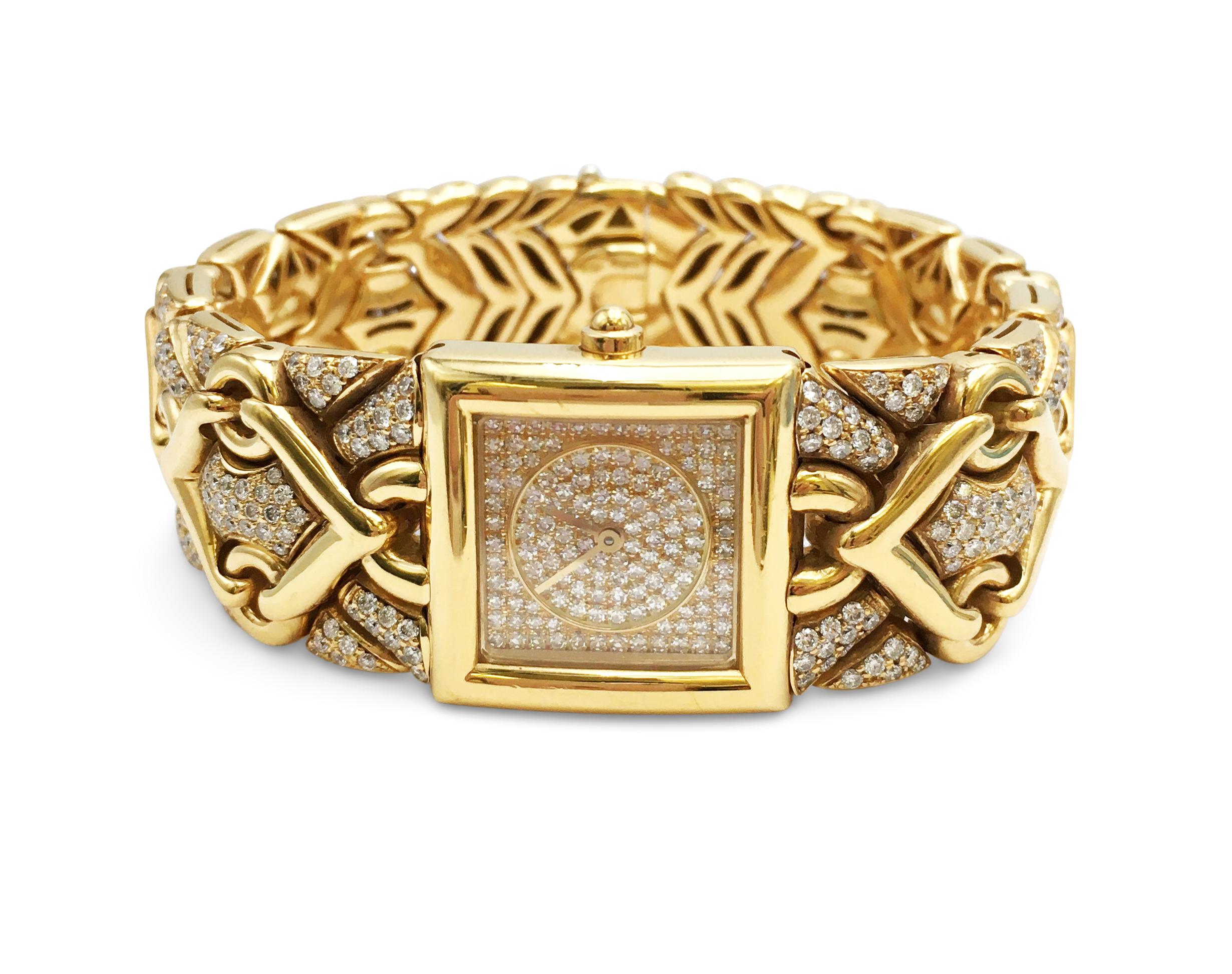 Authentic Bulgari 'Trika' ladies watch crafted in 18 karat yellow gold featuring a chevron-patterned band that is set with an estimated 3.95 carats of high-quality round brilliant cut diamonds. The square-shaped dial is set with pave diamonds