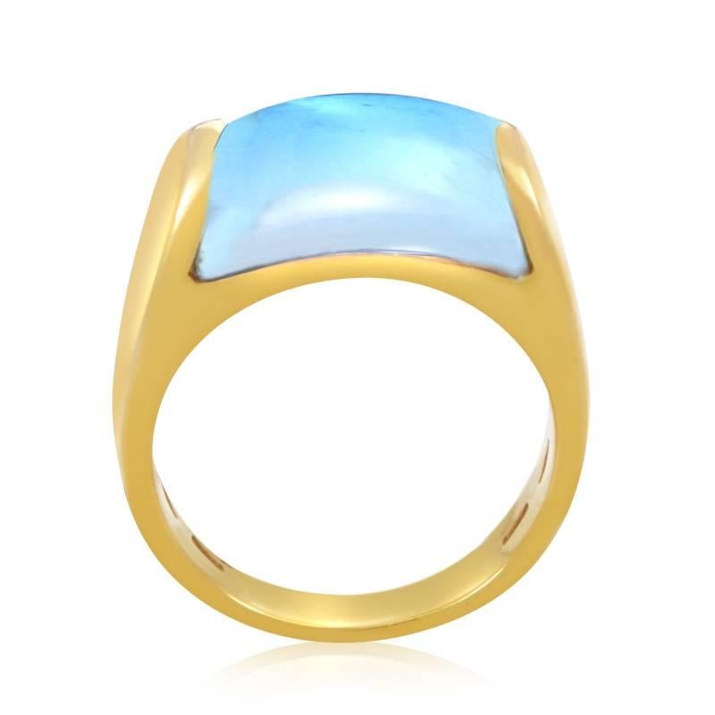 Incredibly crafted, this imaginative Bvlgari ring features 18K yellow gold body set with a charmingly blue topaz stone that gives enchanting, mystical feel to the piece.