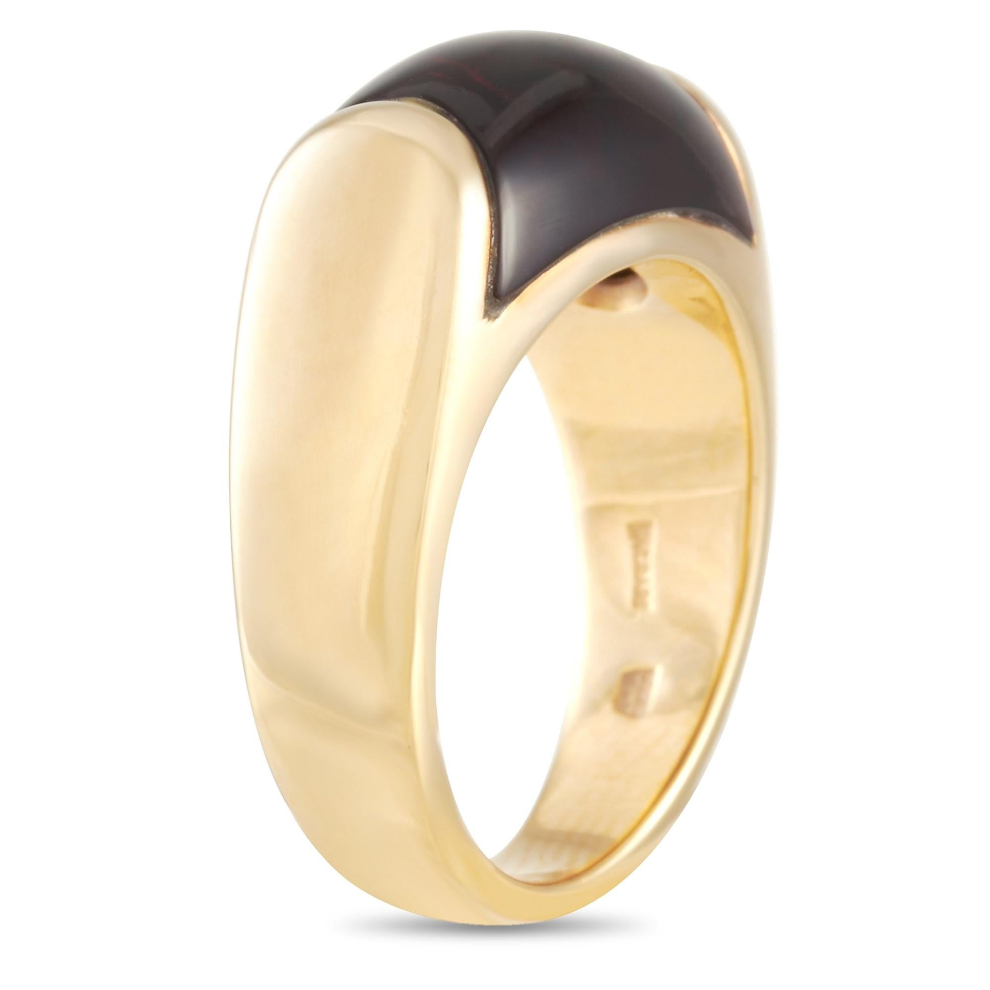 Adorned with a stone of empowerment, this bodacious Bvlgari Tronchetto Ring in 18K yellow gold will make a fine gift for a special January-born lady. This cocktail ring features a 6mm band with 6mm top height decorated at the center with a beautiful