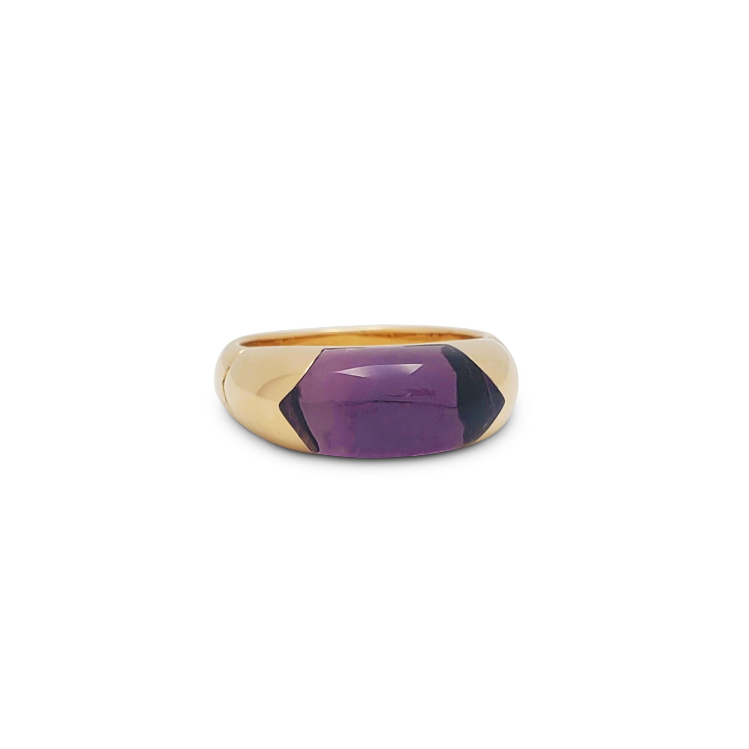 Authentic Bvlgari Tronchetto ring crafted in 18 karat high polished yellow gold.  The ring centers on a gorgeous cabochon amethyst of approximately 3.40 carats.  US size 5 3/4.  Signed Bvlgari, 750, made in Italy, with hallmark.  Ring is presented