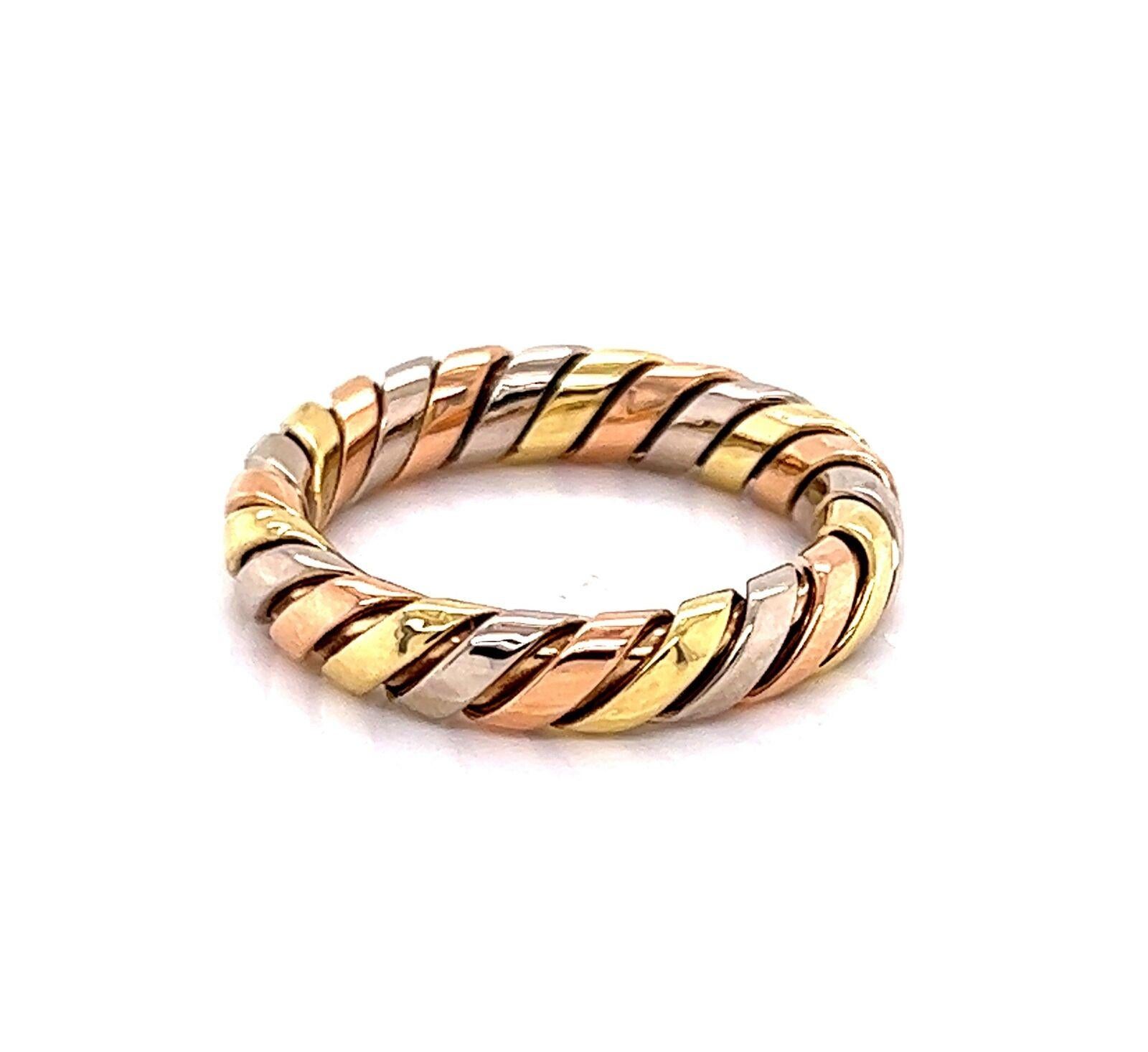 Brand:  Bvlgari
Hallmark: Bvlgari 750 96523
Material:  18k yellow, rose and white gold
Ring Size: 6.5
Weight: 5.3 grams

This authentic Bvlgari band ring is from the Tubogas Collection. It is finely crafted from 18k yellow, white and rose gold with