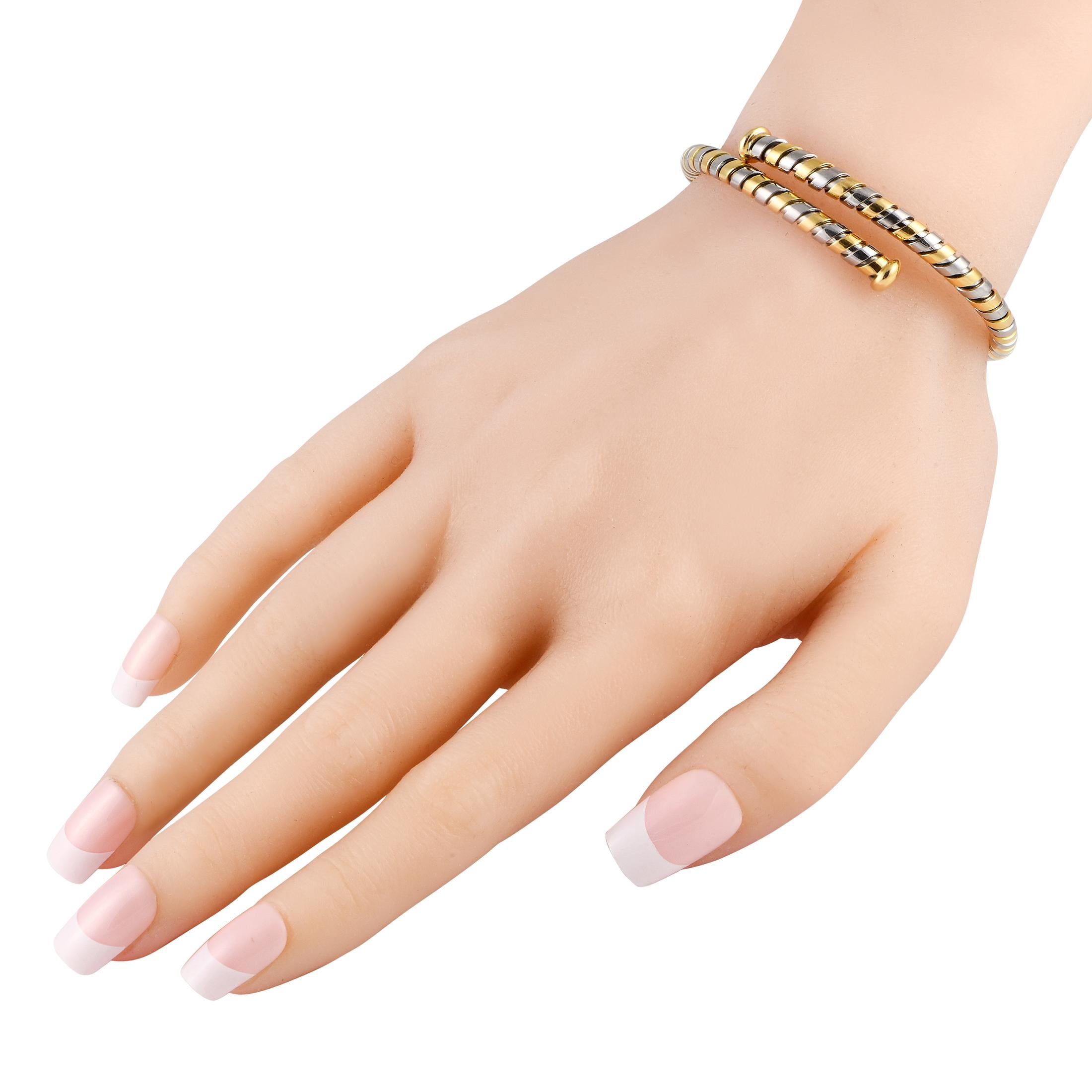 This is a classic Bvlgari jewel featuring their signature Tubogas style. It is a bangle bracelet that coils around the wrist, made of a combination of stainless steel and 18K yellow gold. The bracelet measures 6.28 and weighs 17 grams.This Bvlgari