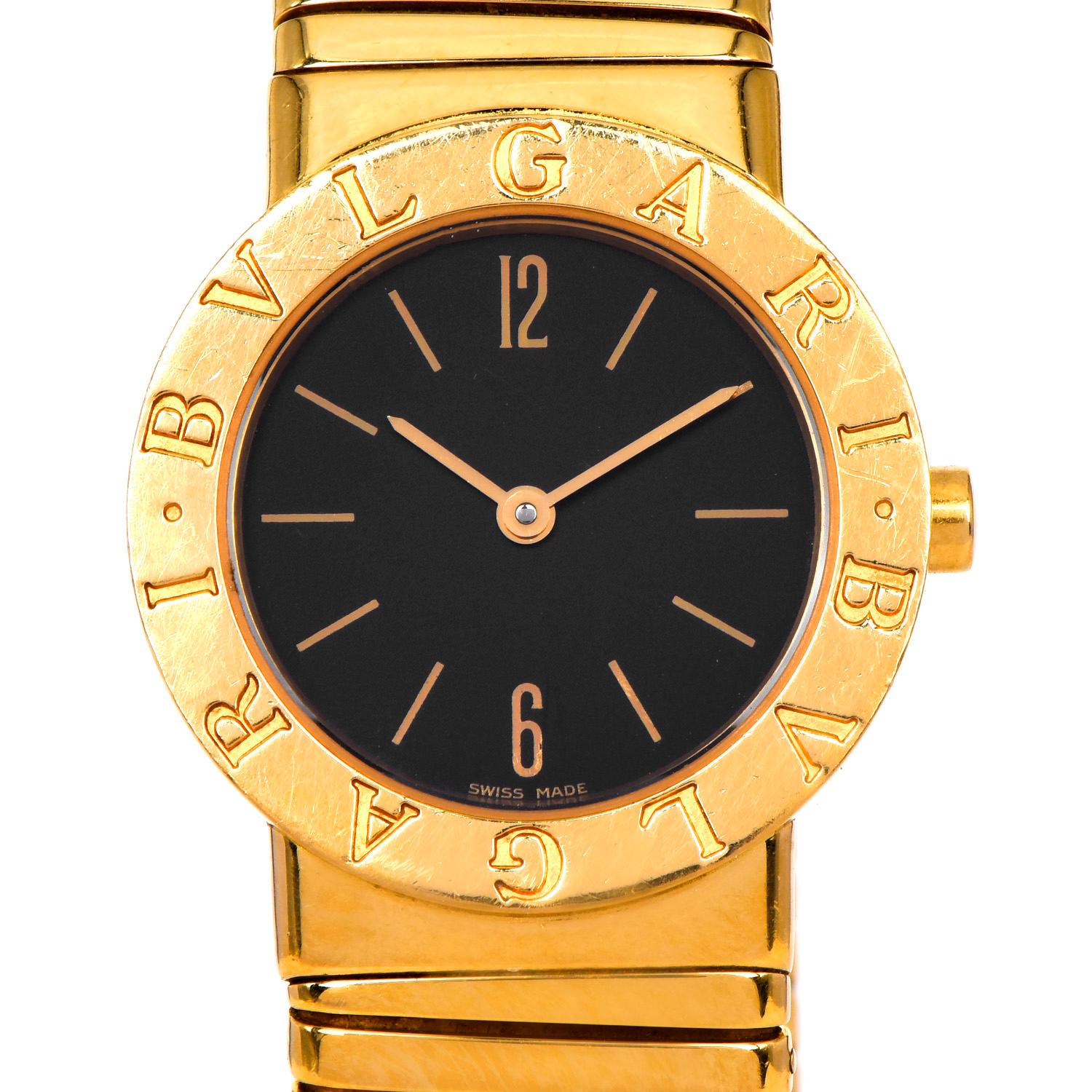 This midsize Ladies Bvlgari Bulgari Tubogas watch in 18k yellow gold, a timeless highly desired masterpiece, perfect for everyday wear.

It has a beautiful black dial with gold numeral markers. Watch, dial, case, band, all signed Bvlgari.

Weighs