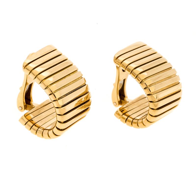 All one needs is a glance at these Tubogas earrings by Bvlgari to imagine how beautifully they'll sit on the ears. They come in a design of fine lines made from 18k yellow gold and finished with clips at the back. They are not just easy to put on