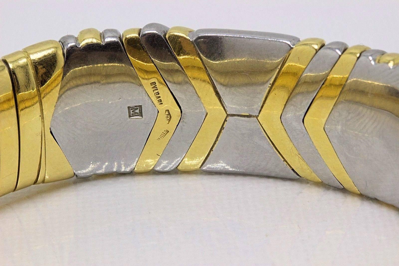 Brand:  BVLGARI
Style:  Alveare Tubogas Bracelet Cuff
Metal:  18KT White & Yellow Gold
Size:  7.50 Inches   
Weight:  69.56 Grams
Width:  15 MM
Hallmark:  