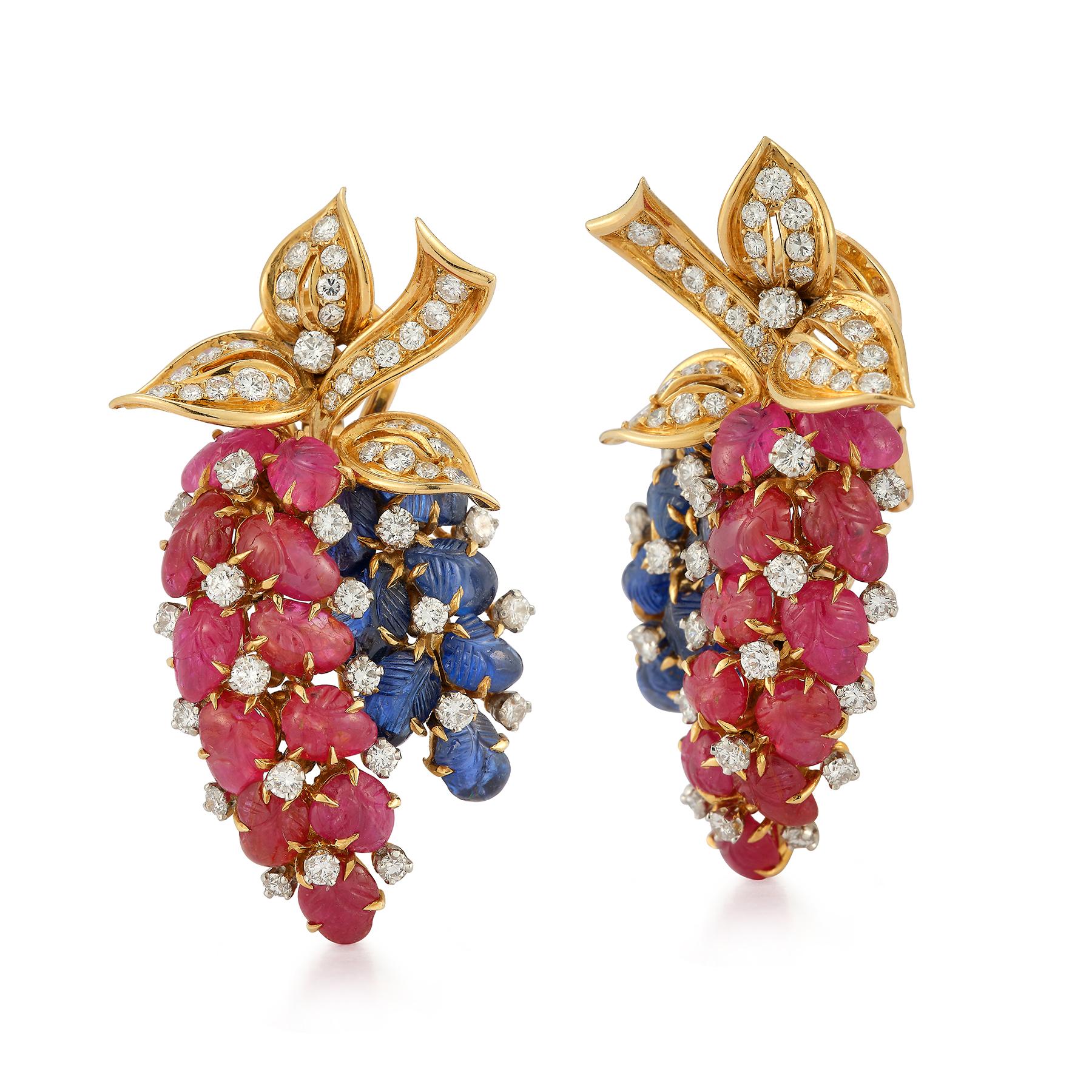 Tutti Frutti Earrings by Bulgari 

Carved rubies & sapphires with round cut diamonds set in 18k yellow gold.
Diamond Weight: approximately 1.10 cts

Back Type: clip on

Measurements: 1.5
