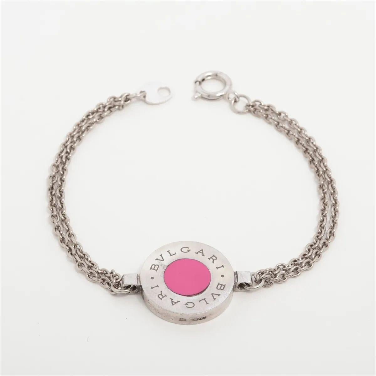 The Bvlgari Two-Layer Chain Bracelet in red and silver is a refined piece of jewelry that captures the brand’s timeless elegance. Designed with a polished silver-tone double-layer chain, it creates a sleek, layered effect on the wrist. At its