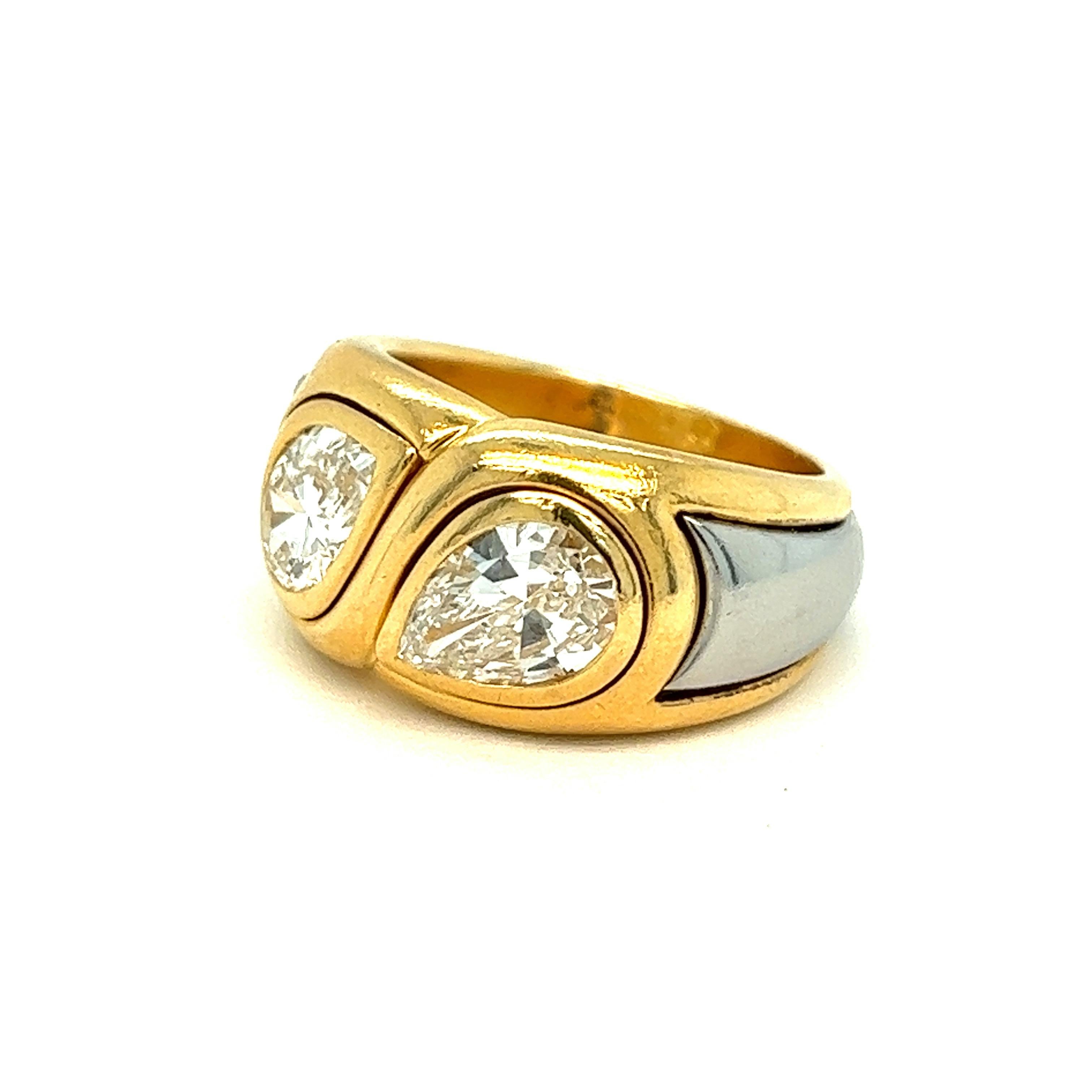 Bvlgari two pear-shaped diamond gold ring

Bezel set pear-shaped diamonds of 2.05 carats, 18 karat yellow and white gold; marked Bvlgari, maker's mark, Italian assay marks, cts 2.05

Size: 6.25-6.5 US; top width 1.1 cm
Total weight: 13.5 grams