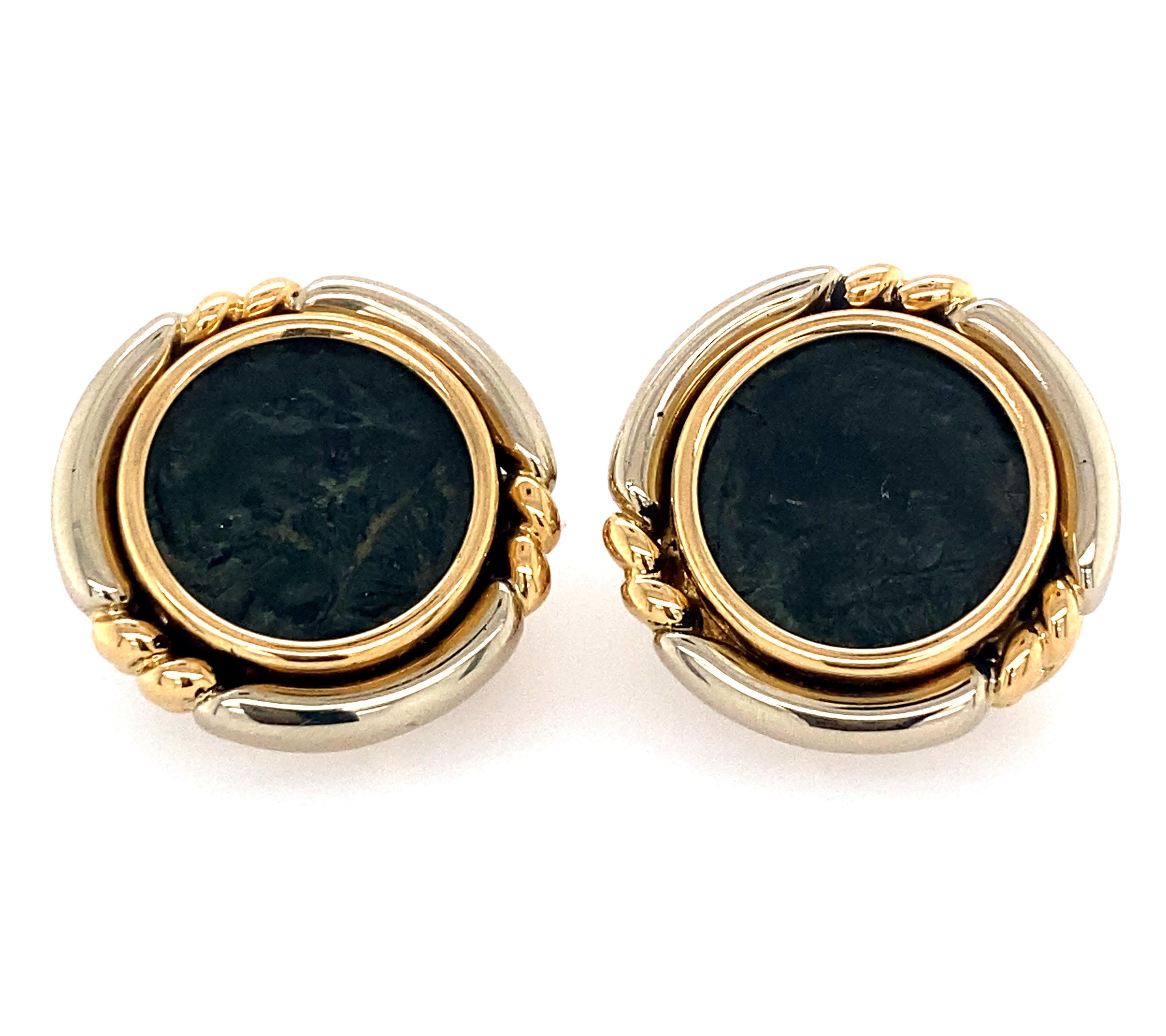 A very rare pair of 18k two tone yellow gold and white gold Ancient Roman coin earrings by Bvlgari. Earrings are  20mm x 20mm. Marked: Bvlgari with Italian maker mark, 750. Weight - 26.6 grams.
Inscription in the back of earring in regards to the