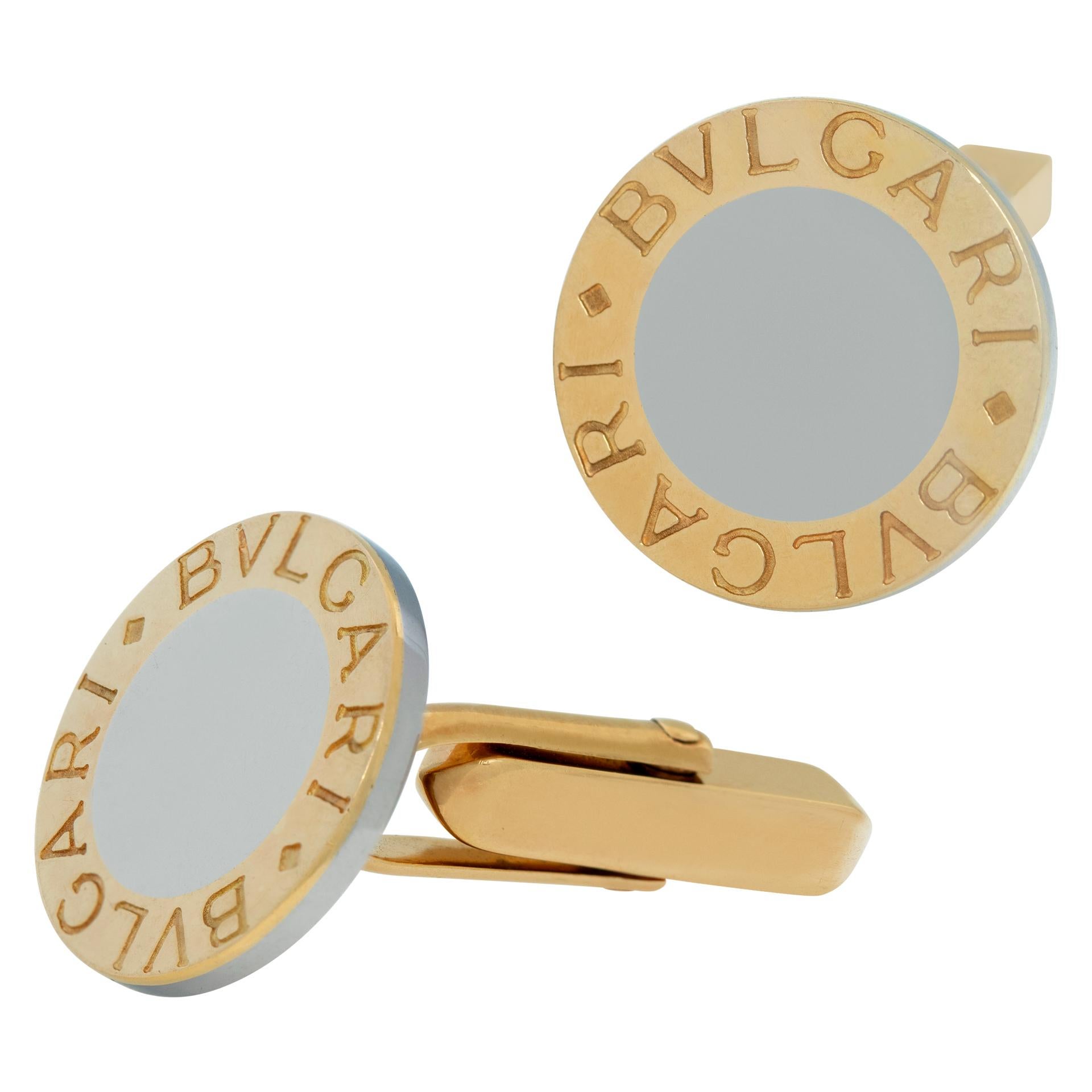 Bvlgari Two Tone 18k yellow gold and stainless steel cufflinks. Measures 1 inch.
