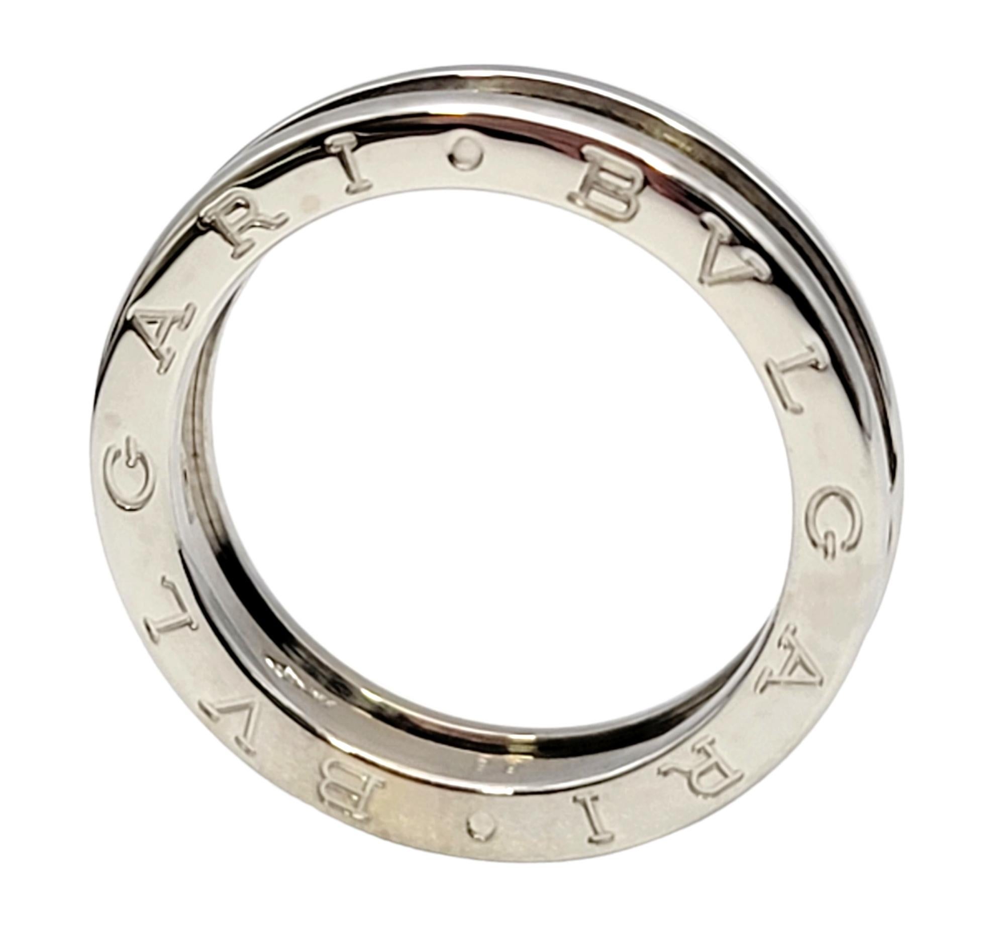 Ring size: 8.5

Sleek 18 karat white gold contemporary designer band ring by Italian luxury brand, Bvlgari. 

Metal: 18K White Gold
Ring size: 8.5
Euro size: 58
Outer diameter: 24.3 mm
Band Width: 4.82 mm
Weight: 6.8 grams
Stamped: Made in ITALY,
