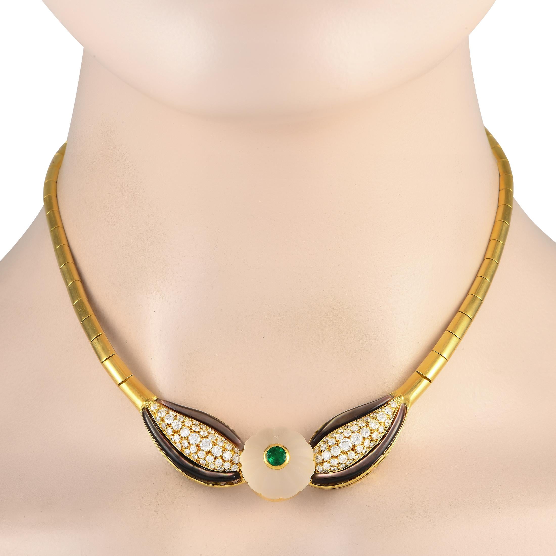 Fancy some drama in your wardrobe? Bring the allure of the 80s through this vintage Bvlgari necklace. The necklace is composed of half-round bar links, in 18K yellow gold, leading to a decorative center. Taking centerstage is a domed and fluted rock