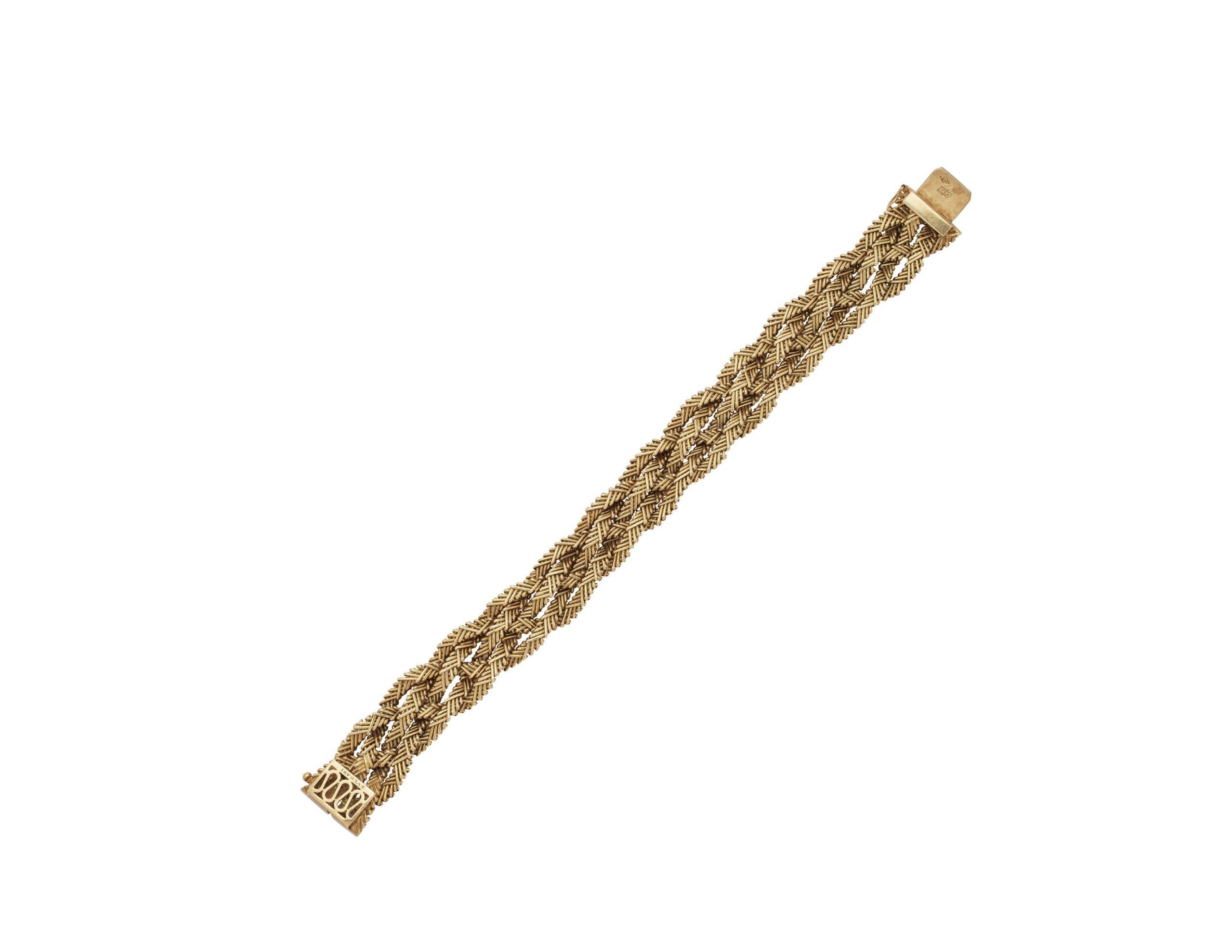 Bvlgari Vintage 18K Yellow Gold Braided Bracelet 

Details:
Signed 'Bvlgari', Italian registry mark, weight 67.6 grams, length 8 inches, width 3/4 inch.

In excellent condition