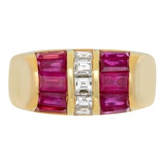Bvlgari vintage emerald cut diamonds & baguettes rubies ring in yellow gold.