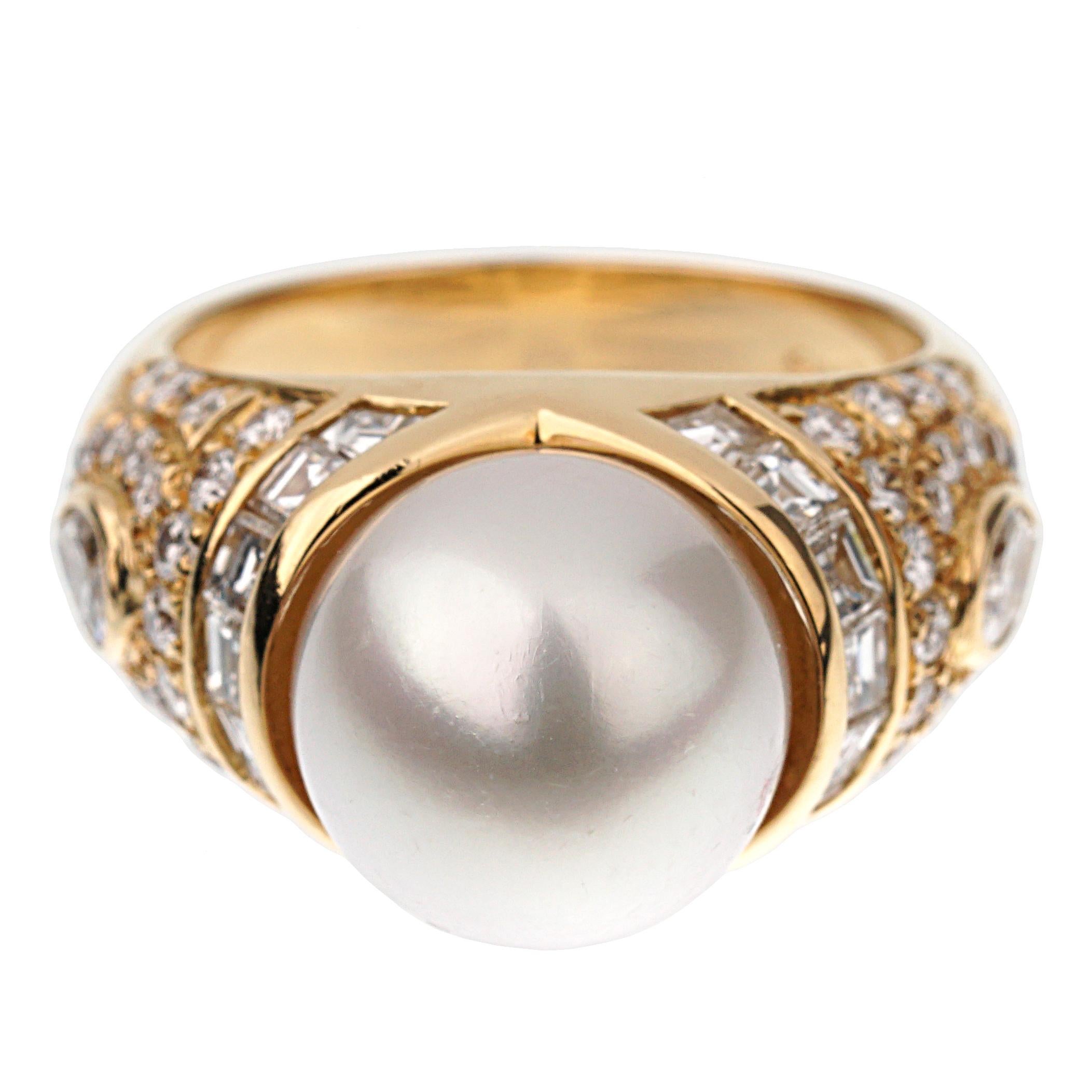 A fabulous Bvlgari ring showcasing a plethora of multiple shaped diamonds, set with round brilliant cut, pear, and carre cut diamonds. This ring showcases 1.25ct appx, and is topped with an 11mm pearl. The ring measures a size 5 3/4 and can be
