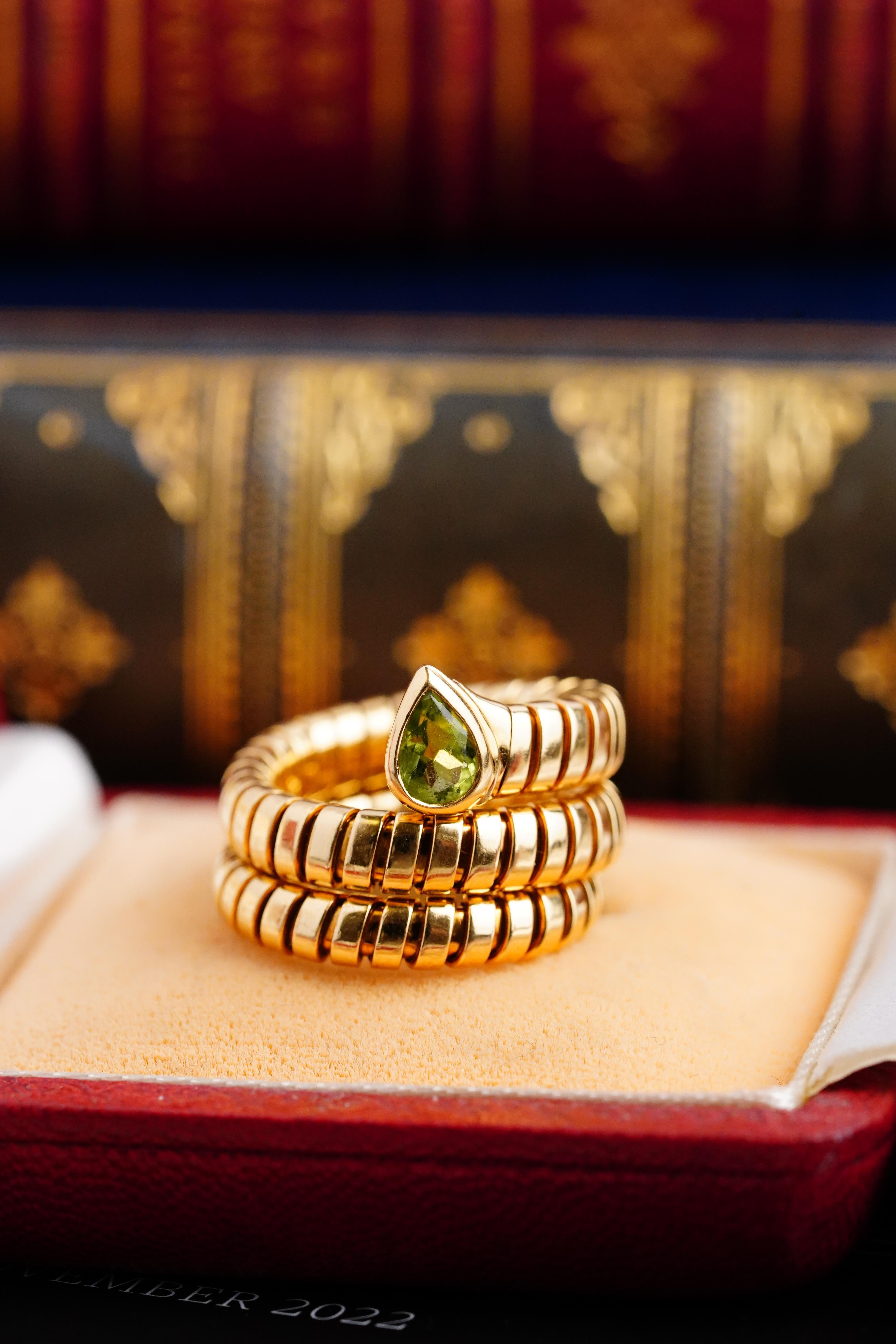 Enjoy this iconic 80s Bvlgari ring, an exquisite piece of jewellery that exudes elegance and luxury. 
The Ring itself is made from high-quality 18K yellow gold and is crafted in Bulgari's signature Serpenti Tubogas collection. Merging two of the