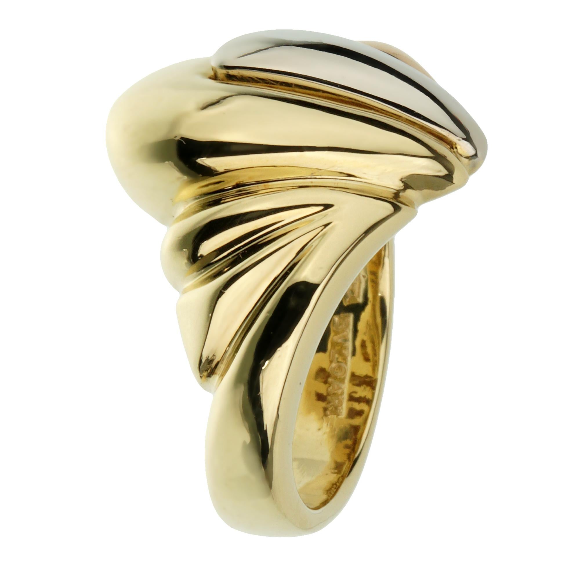 Introducing the Bvlgari Vintage Tricolor Gold Cocktail Ring, a magnificent fusion of timeless design and unparalleled craftsmanship that embodies the essence of the iconic Bvlgari brand. This exquisite piece showcases an intricate tricolor gold