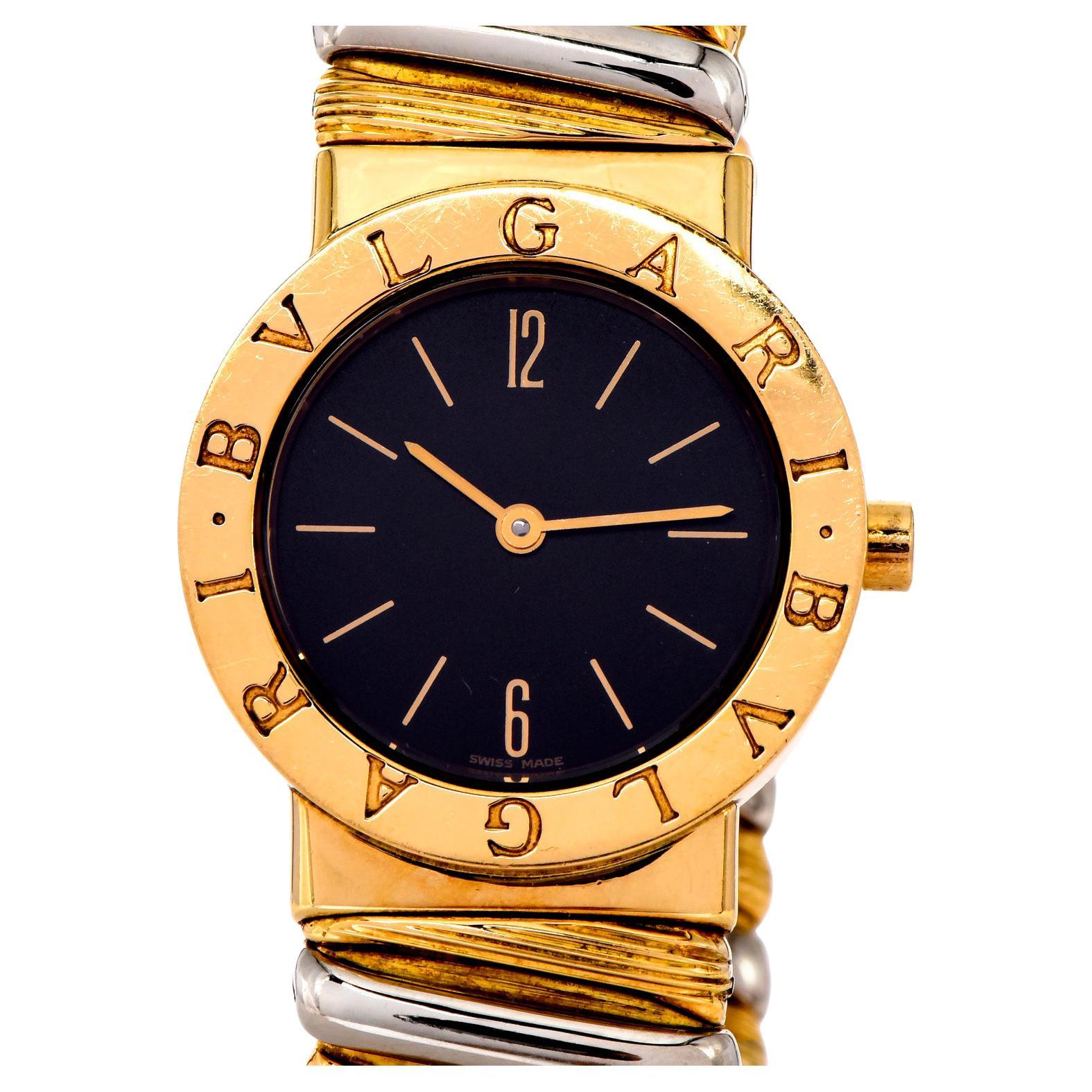 Mid-Size Vintage Ladies Bvlgari Bulgari Tubogas watch in 18k yellow & white gold, a timeless highly desired masterpiece, perfect for everyday wear.
It has a beautiful black dial with gold numeral markers. Watch, dial, case, band, all signed