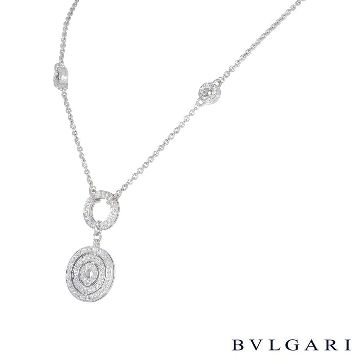 An 18k white gold diamond necklace by Bvlgari from the Astrale collection. The necklace features a double drop circle pave set with round brilliant cut diamonds with miniature ones spaced out on the chain along with the iconic 'Bvlgari Bvlgari'