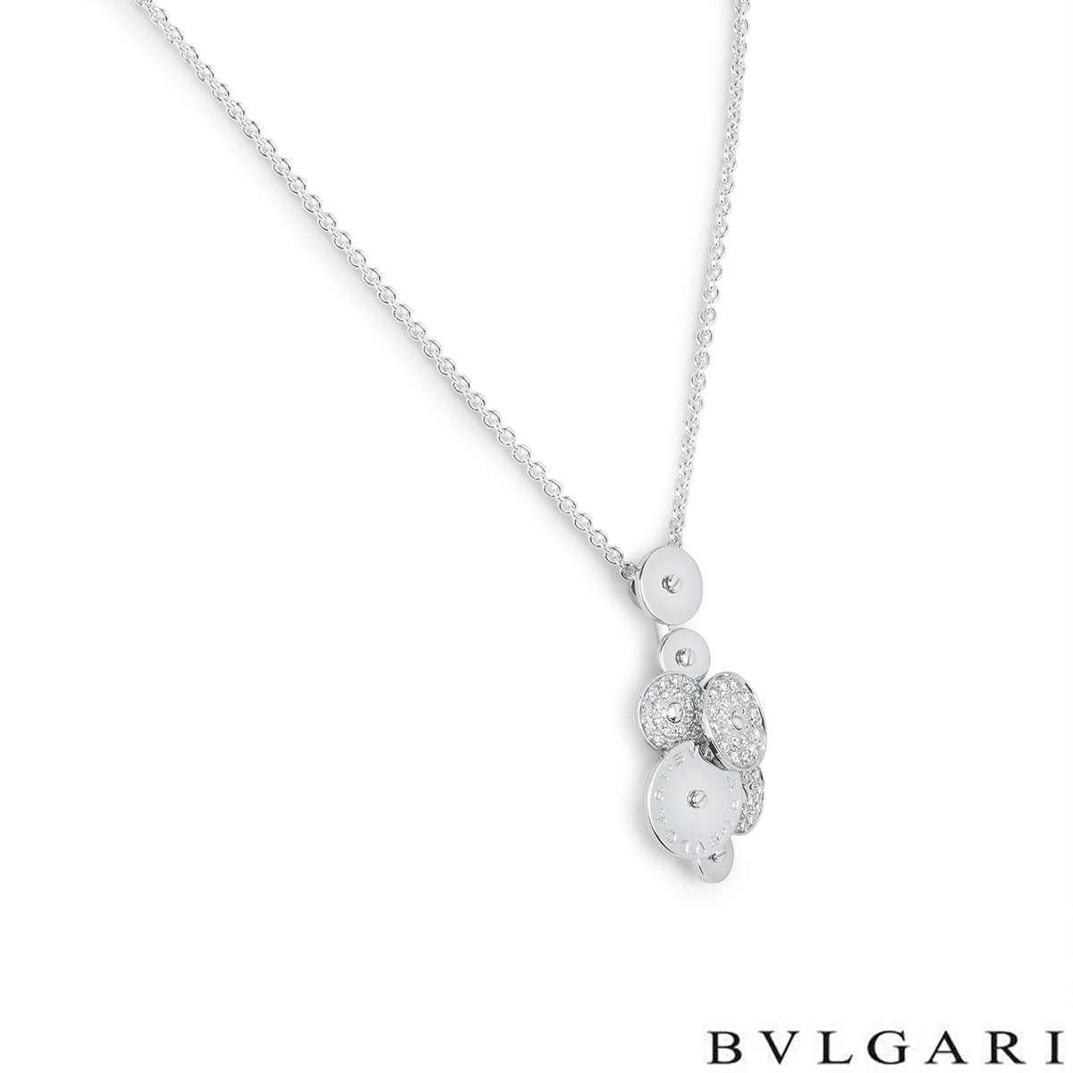 An 18k white gold pendant from the Bvlgari Cicladi collection. The pendant is composed of a cluster of 7 circular spinning discs, each alternating in size. The largest of the discs is engraved with the Bvlgari Bvlgari logo and three of the discs are