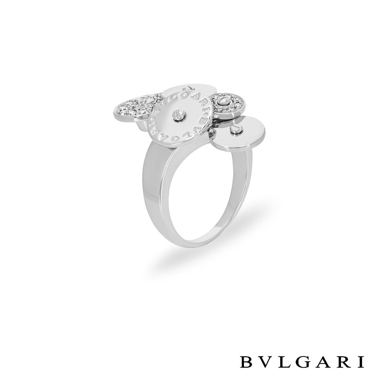 An 18k white gold diamond ring by Bvlgari from the Cicladi collection. The dress ring is composed of a cluster of 5 circular spinning discs, each alternating in size. One of the discs is engraved with the Bvlgari Bvlgari logo, two of the discs are