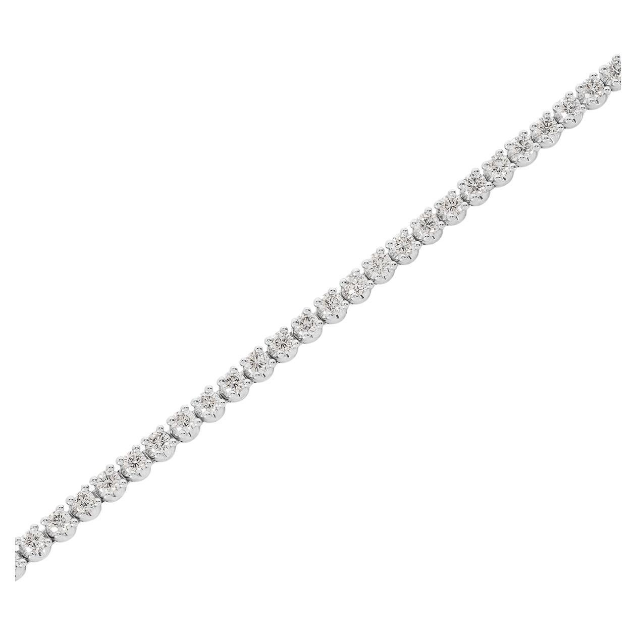 A radiant 18k white gold diamond bracelet by Bvlgari from the Corona collection. The bracelet consists of 44 round brilliant cut diamonds individually set in a four prong setting with an approximate weight of 4.62ct, E-F colour and VS clarity. The