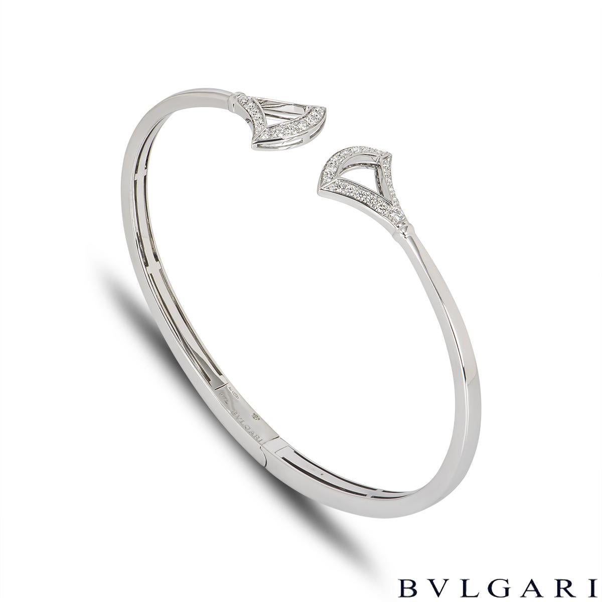 An elegant 18k white gold Bvlgari diamond bracelet from the Divas' Dream collection. The cuff style bracelet has a fan-shaped motif with 18 round brilliant cut diamonds on either end, totalling approximately 0.42ct. The bracelet has a gross weight