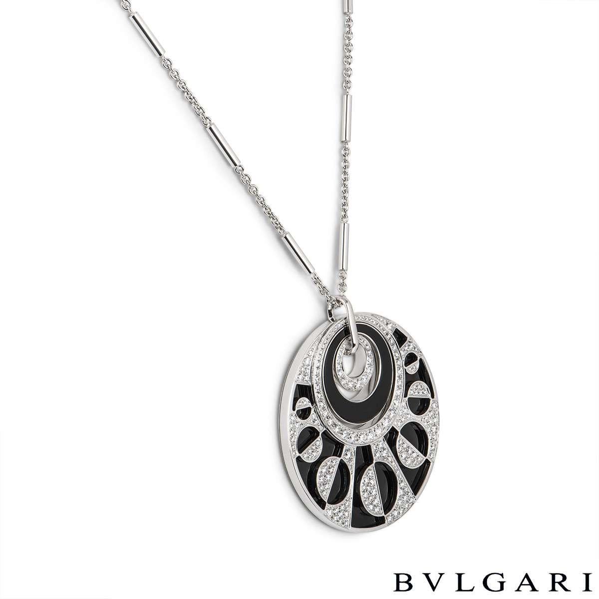 A stunning 18k white gold diamond and onyx large necklace by Bvlgari from the Intarsio collection. The necklace features 3 circular motifs within each other set with an onyx inlay and round brilliant cut diamonds in a pave setting with a total