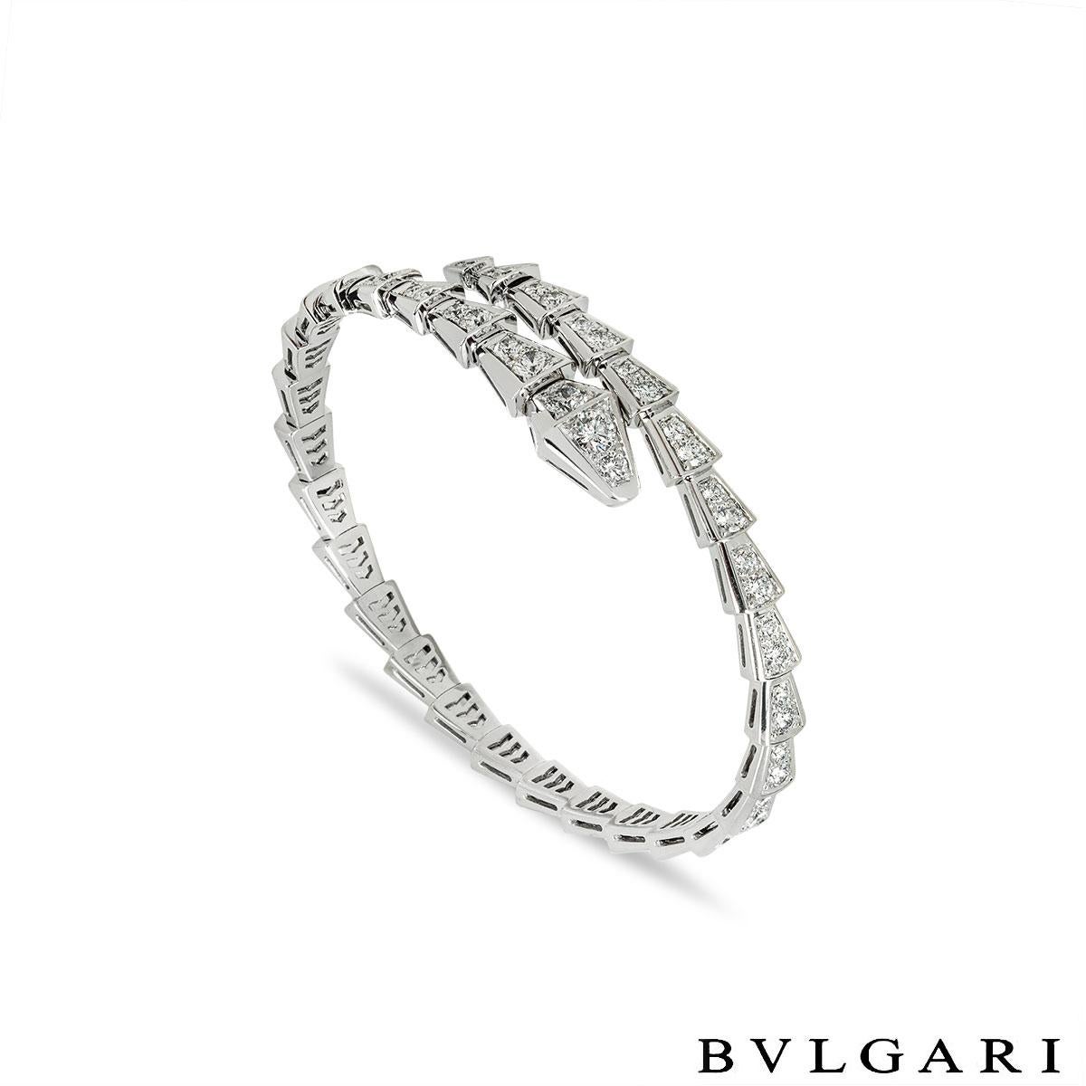 A sophisticated 18k white gold diamond bracelet by Bvlgari from the Serpenti collection. The bracelet is in the form of a serpent that coils around the wrist with 33 diamond set sections. The 68 round brilliant cut diamonds have an approximate total