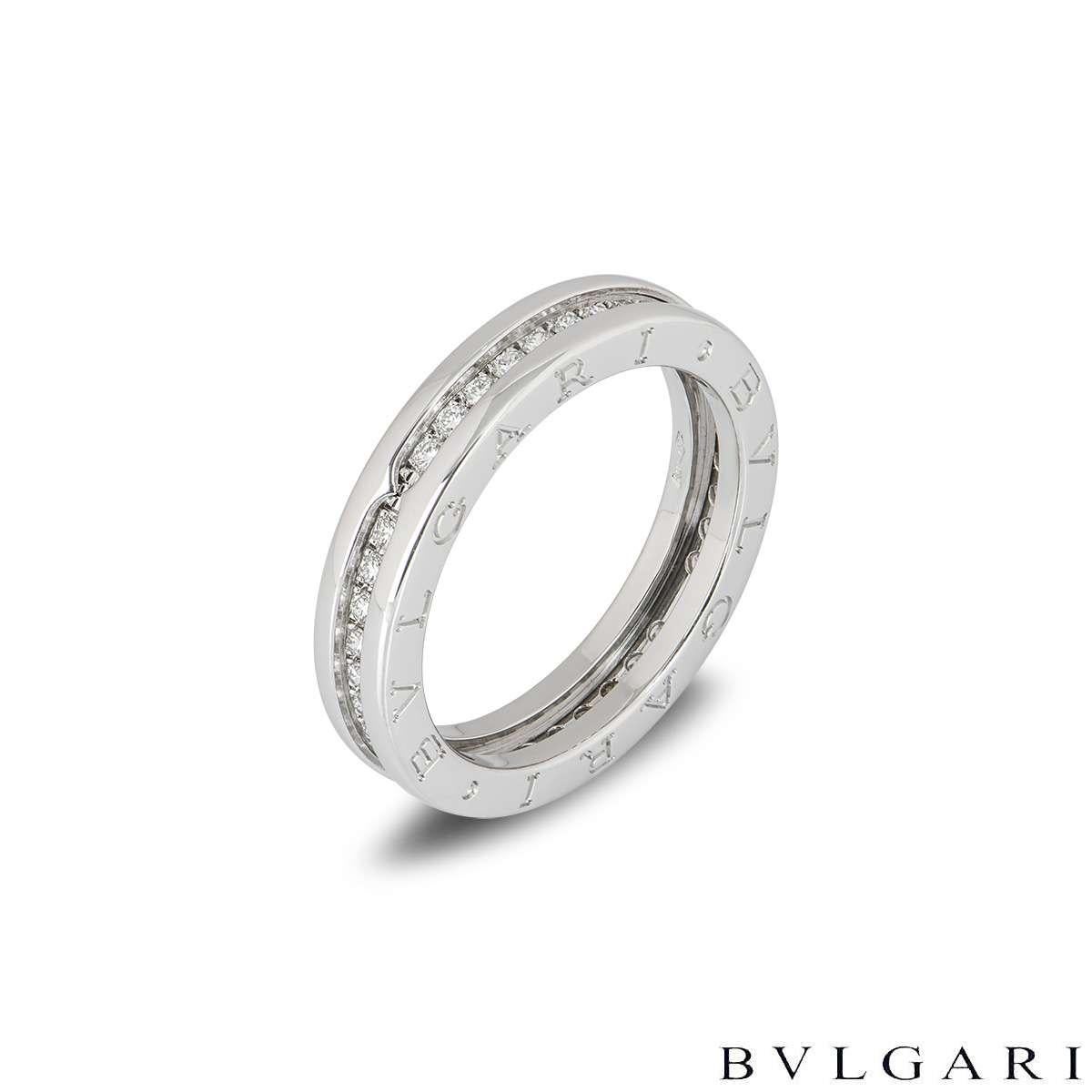 A stylish 18k white gold diamond set Bvlgari ring from the B.zero1 collection. The ring is set through the centre with 38 round brilliant cut diamonds totalling 0.43ct. The ring features the iconic 'Bvlgari Bvlgari' engraving to the outer edges. The