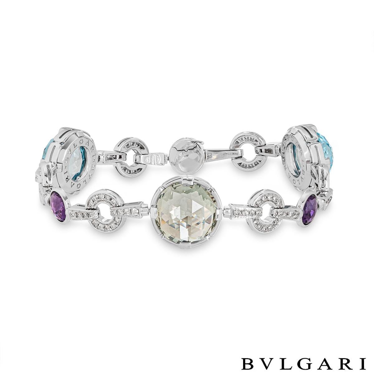 An alluring 18k white gold multi-gemstone and diamond bracelet by Bvlgari from the Parentesi collection. The bracelet features 1 prasiolite, 2 topaz stones and 3 amethyst stones rose cut in a modern setting and evenly spaced throughout. Accentuating