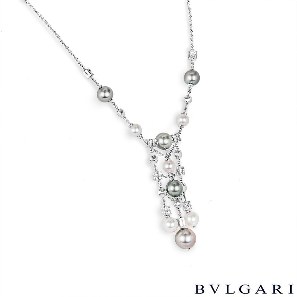 A sophisticated 18k white gold pearl and diamond necklace by Bvlgari from the Lucea collection. The necklace, which has a three-row drop, is set with 6 round dark grey pearls ranging from 9mm-11.8mm displaying a green or purple overtone and 6 round
